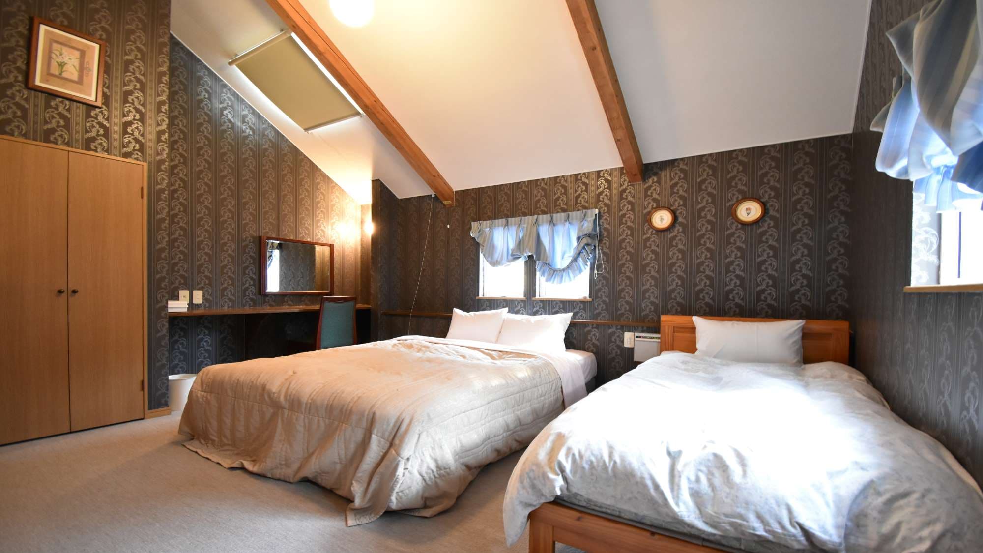 ・ Standard A / One double bed and one single bed in the bedroom