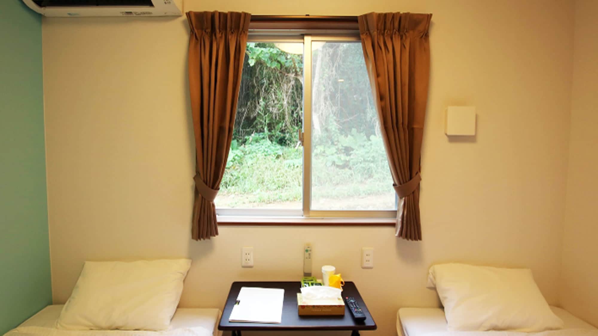 *Standard twin room (example) Large windows for ventilation and checking the weather and temperature outside.