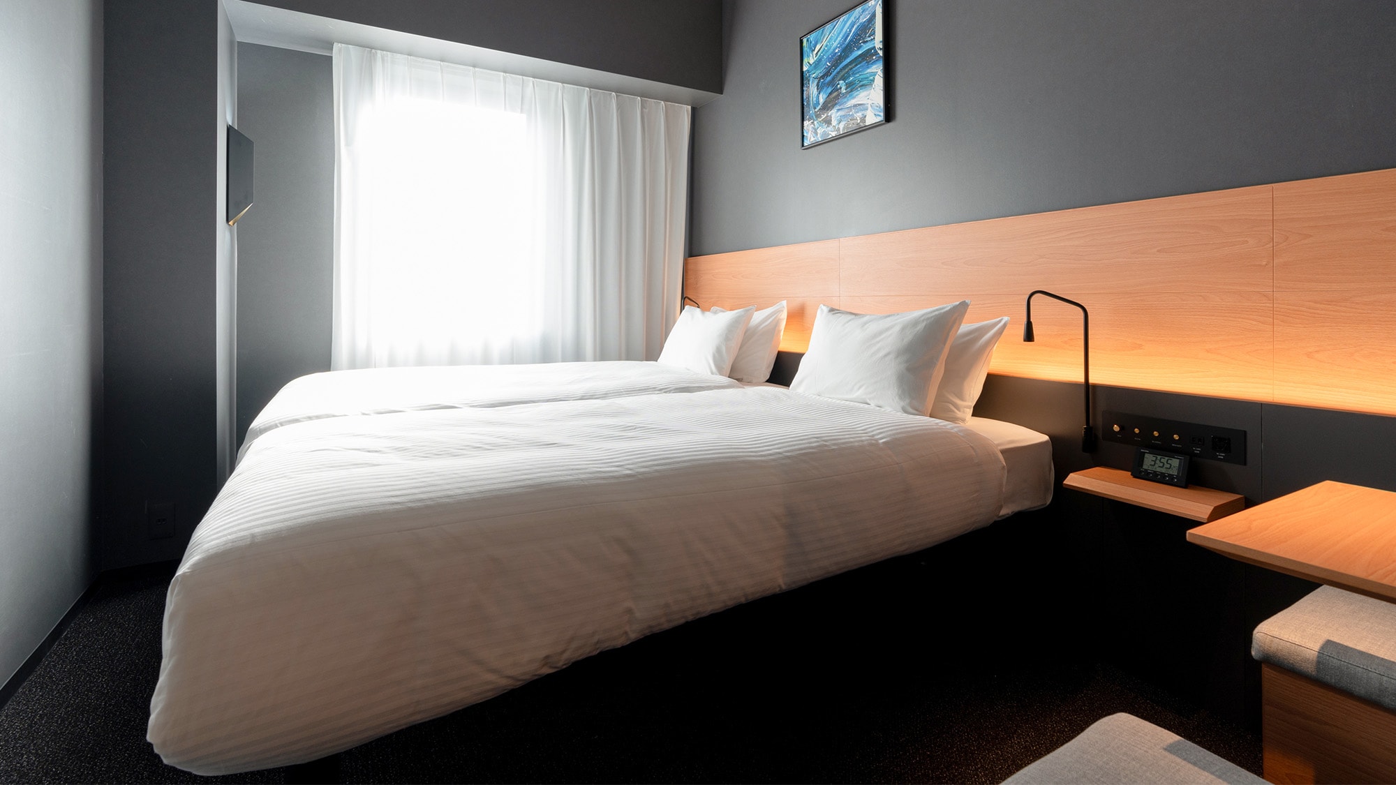 [Compact Twin Room] A sofa and desk are provided in the room.