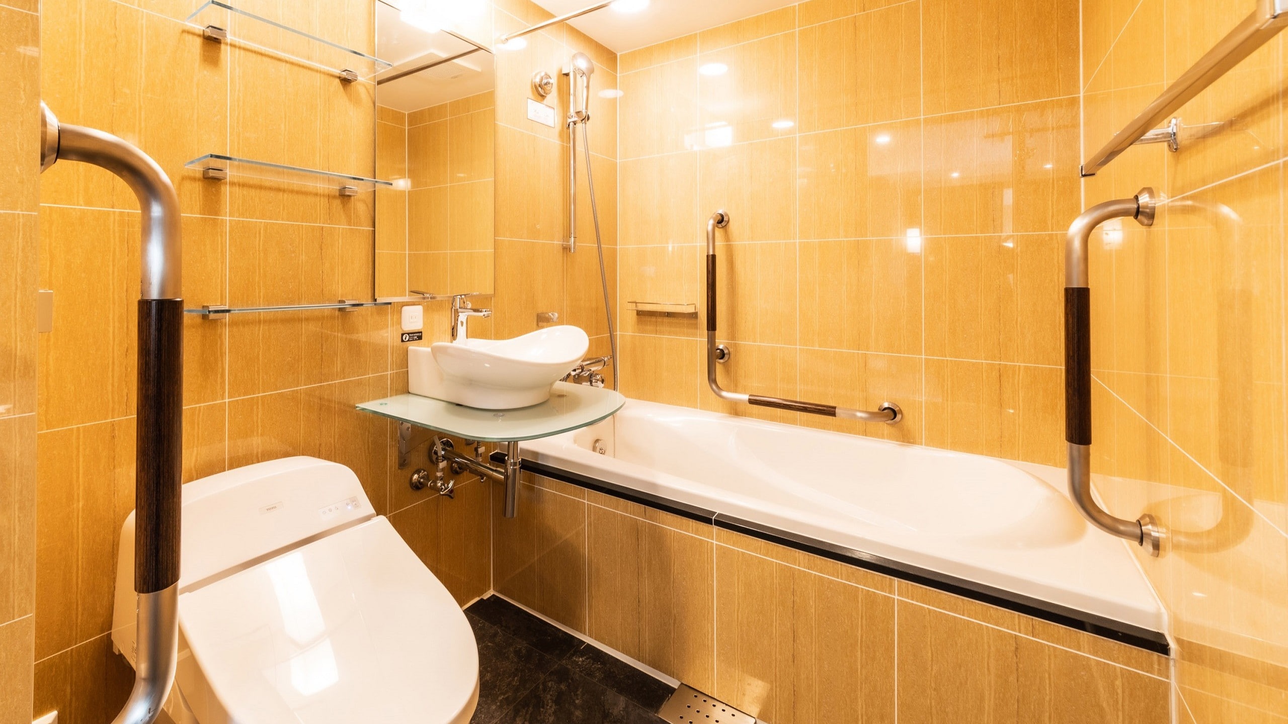 The bathtub is 50cm deep, 65cm wide, and 130cm long. There are no steps at the bathroom entrance.