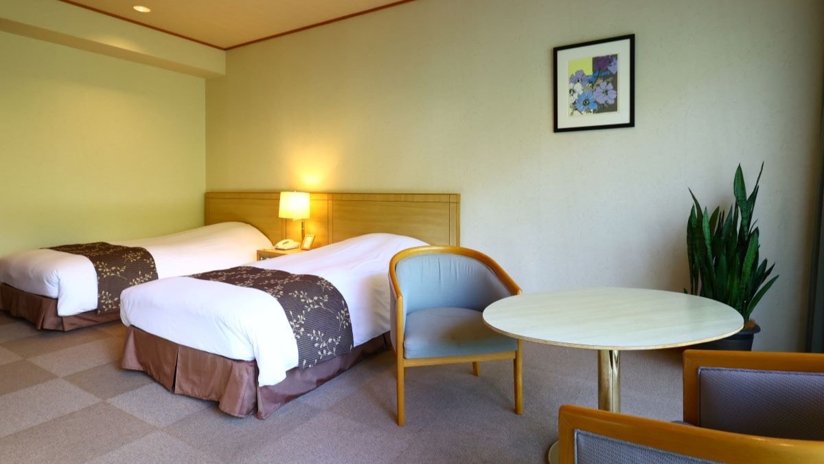 【宽敞的西式双床房】这种房型可以让您脚踏实地的放松。