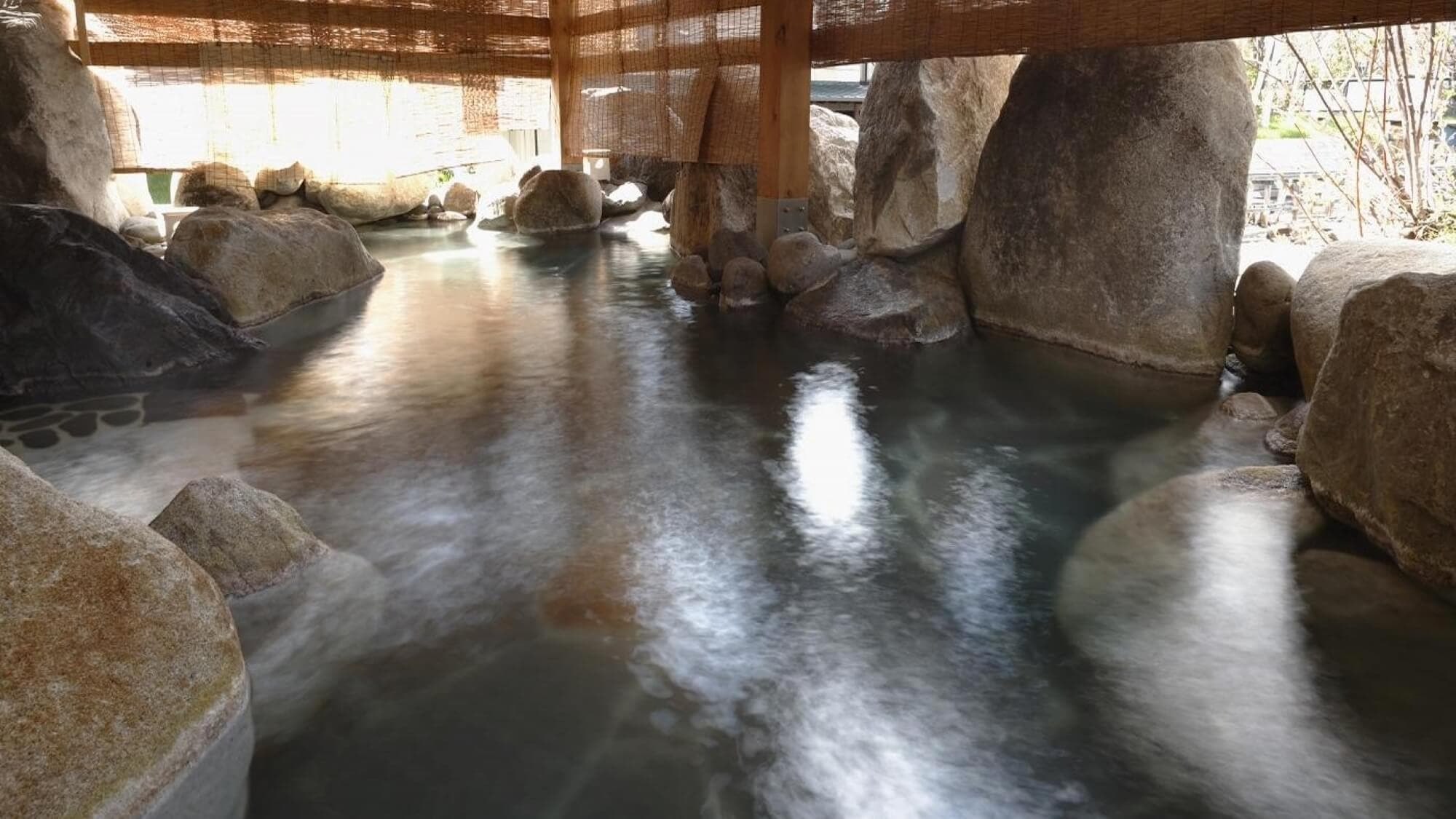 The large open-air bath is a 100% natural hot spring with water directly from the source.