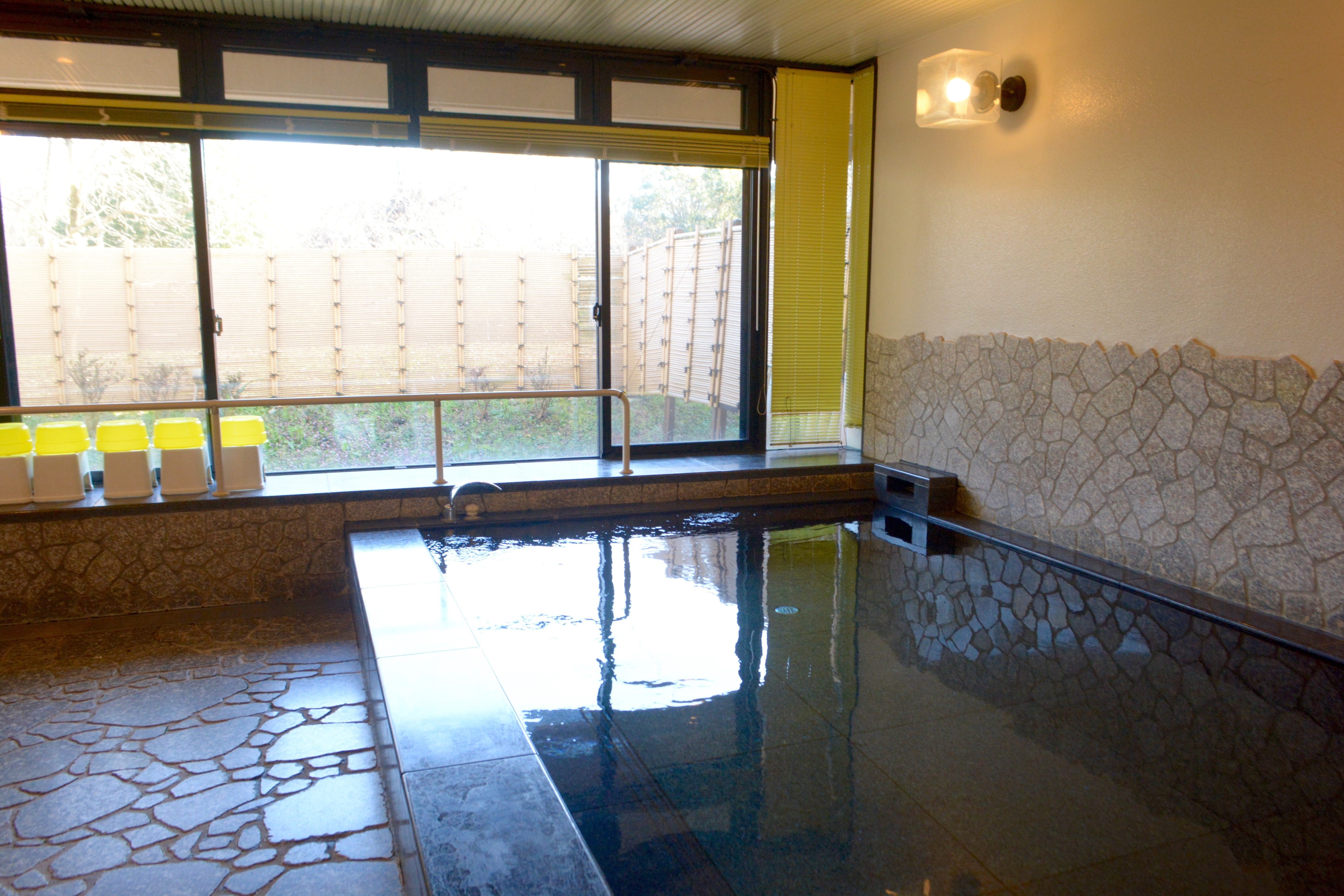 Large public bath facing the window