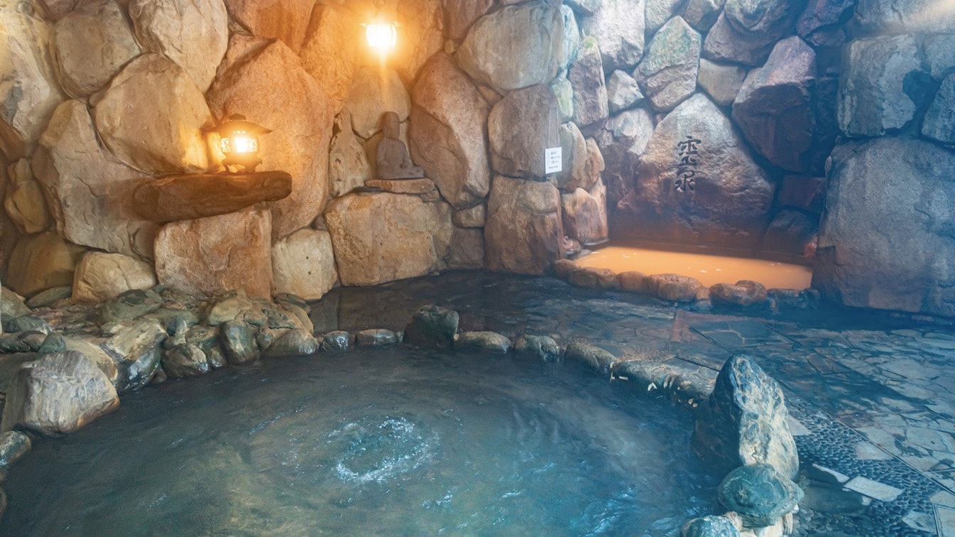 Golden spring and plain hot spring in rock bath