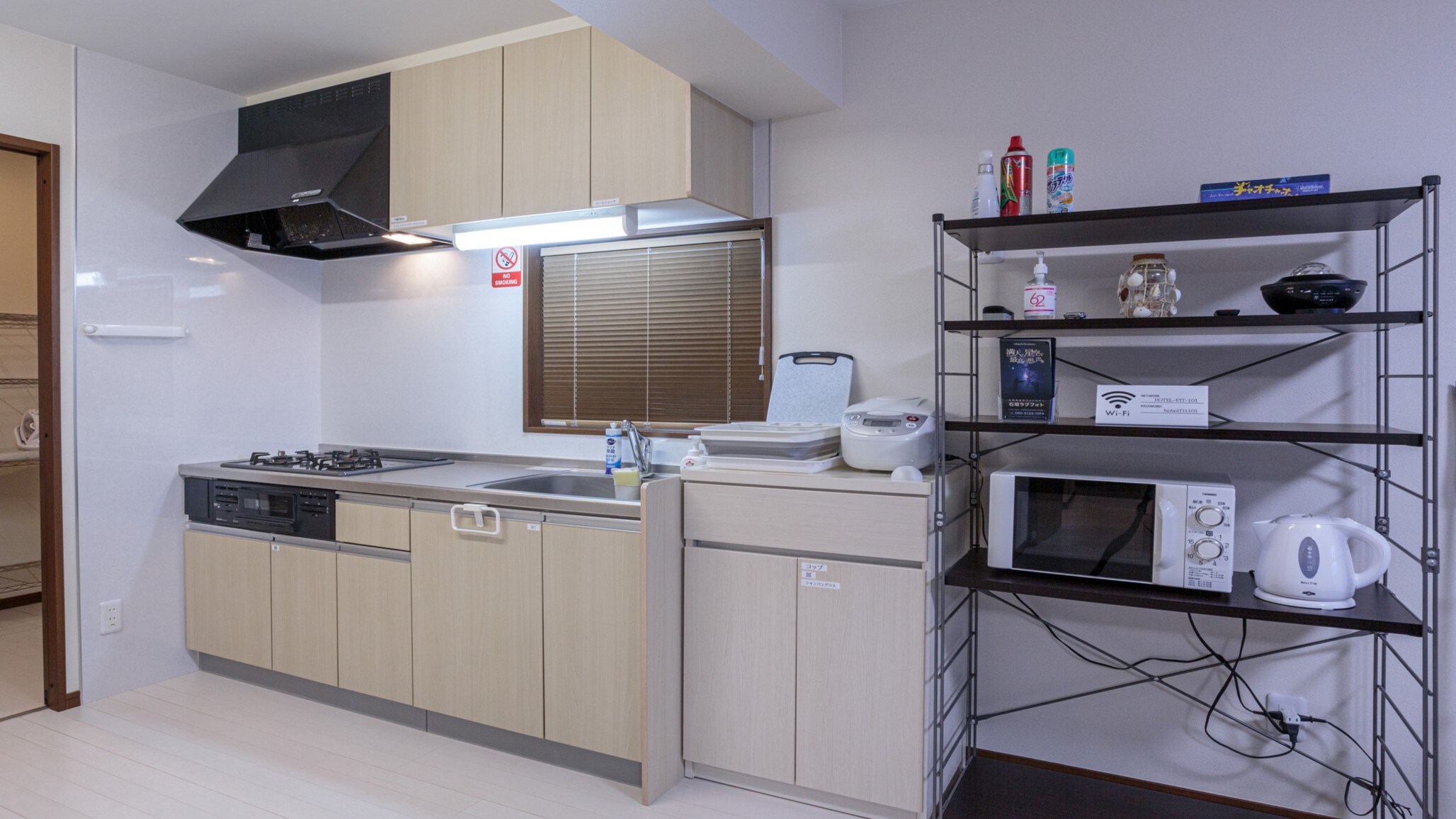 101: Kitchen: Gas stove, refrigerator, microwave, electric pot, frying pan, cooking utensils, tableware