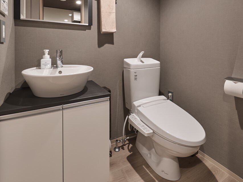 The toilet is equipped with a washlet for a clean environment.