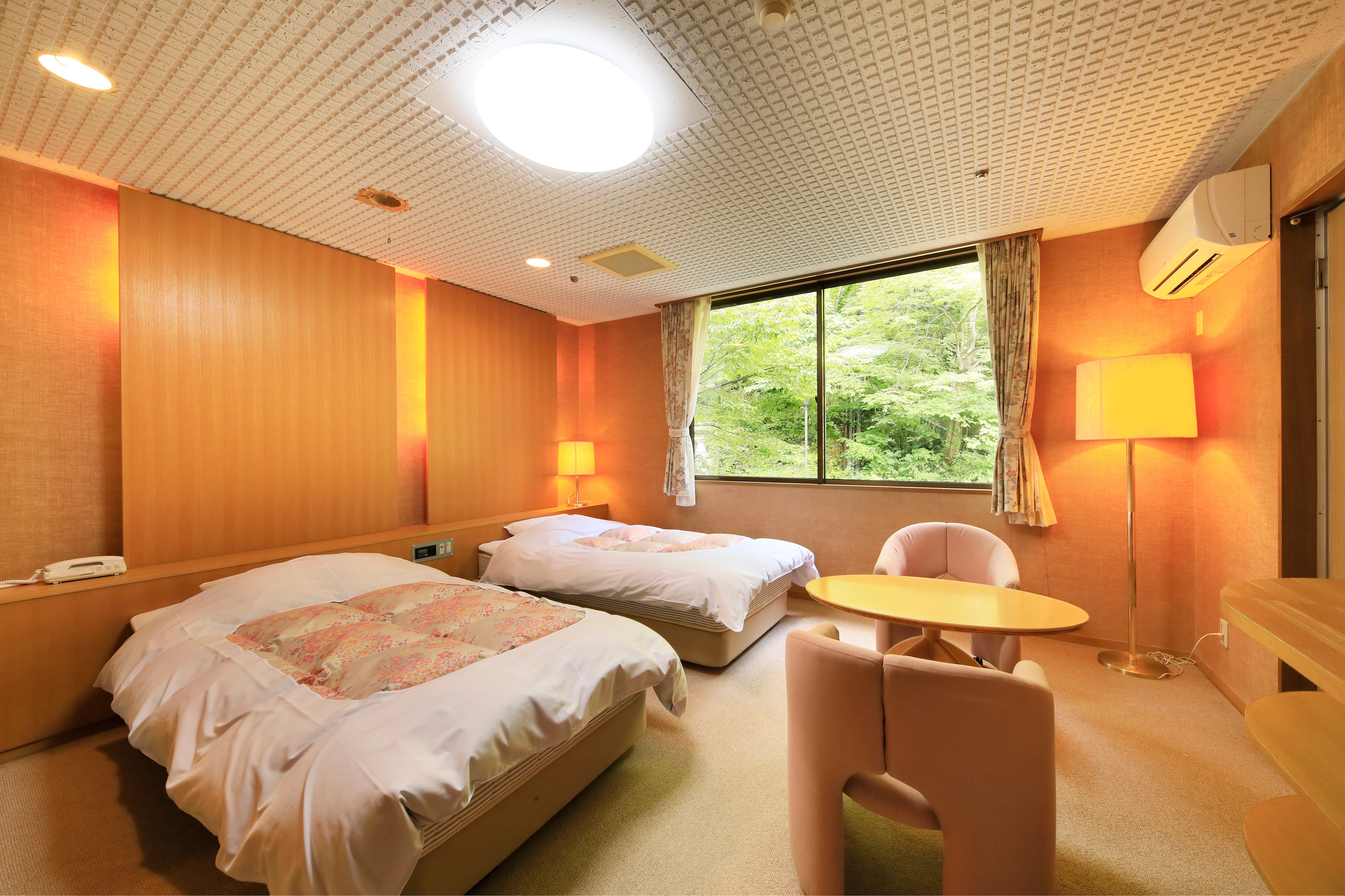 Mountain-facing twin-bed room.