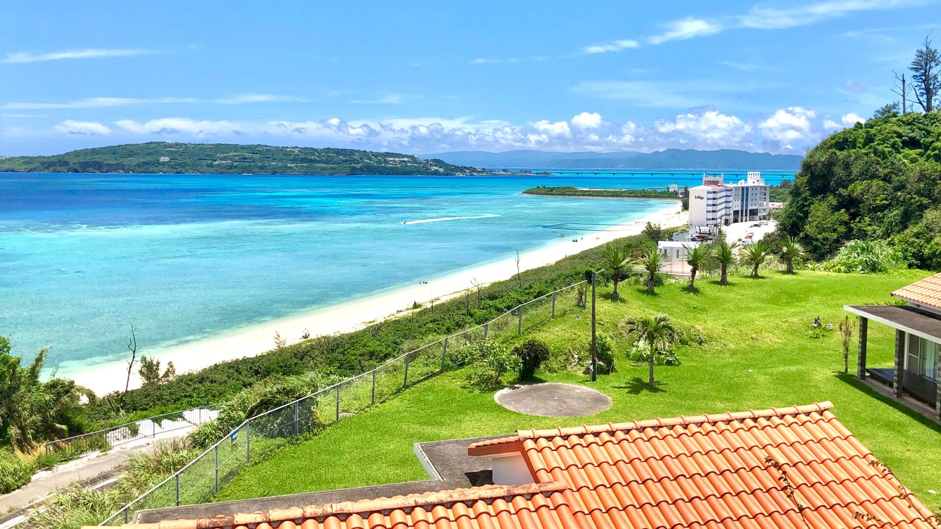 Red tile cottage on a hill overlooking Kouri Island and the sea