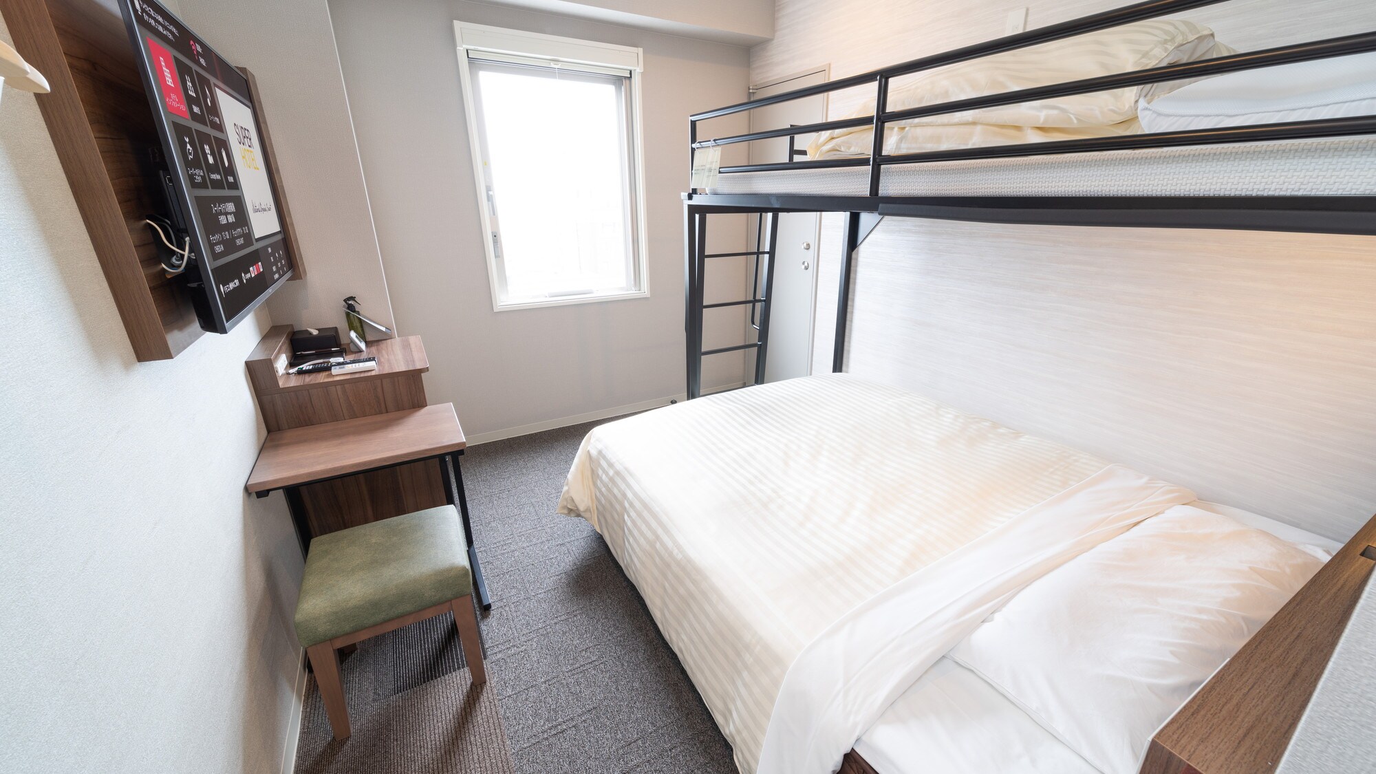 This is a super room with a double bed and a loft bed.