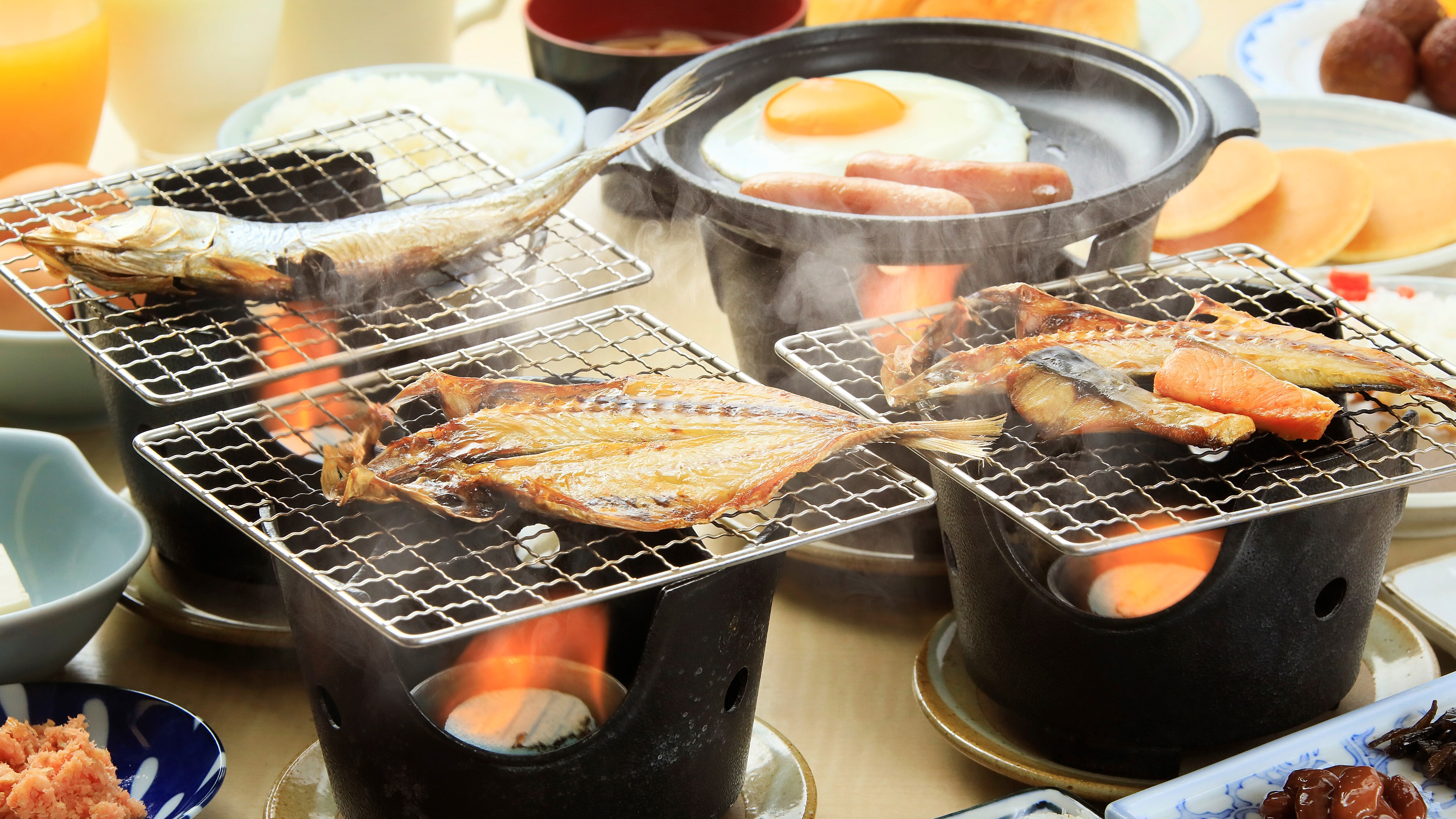 A breakfast buffet with a wide selection of Japanese and Western dishes *Example