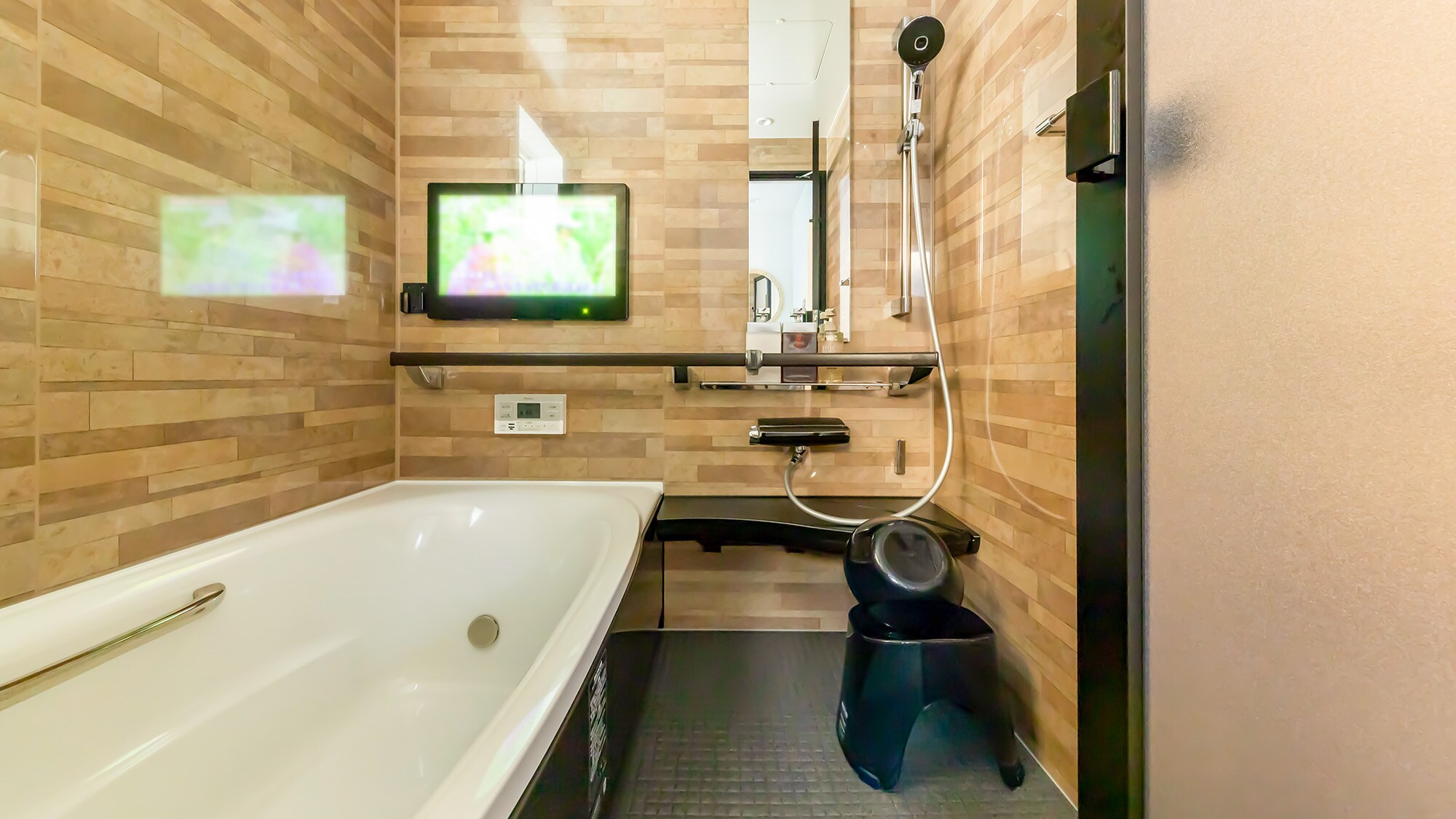 ・A bathroom with a TV. You'll want to take a long bath.