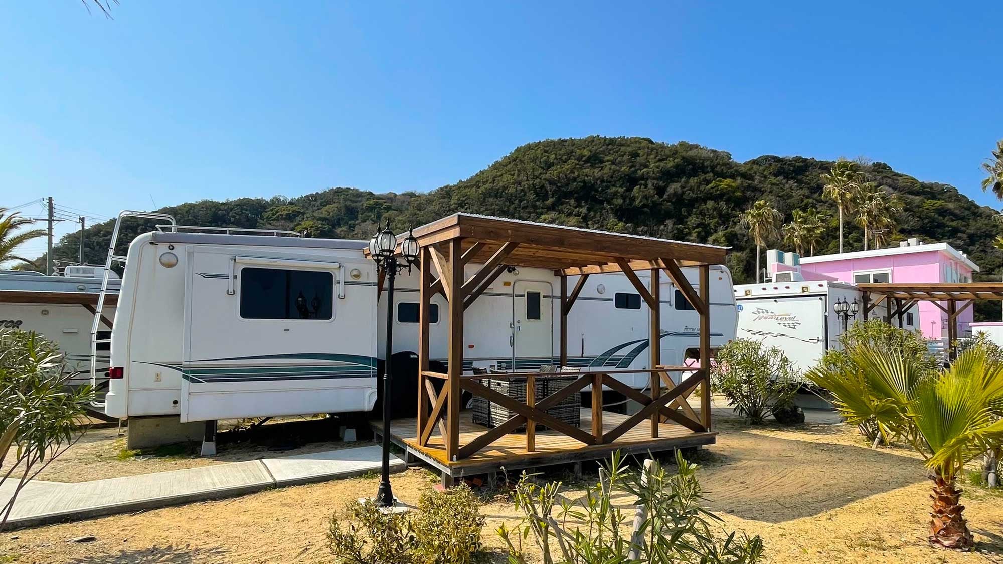 There is a trailer house _ wood deck