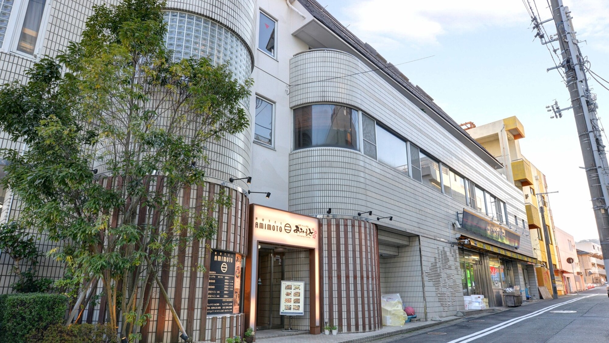 *Welcome to Hotel Amimoto! Look for the drooping greenery next to the entrance.