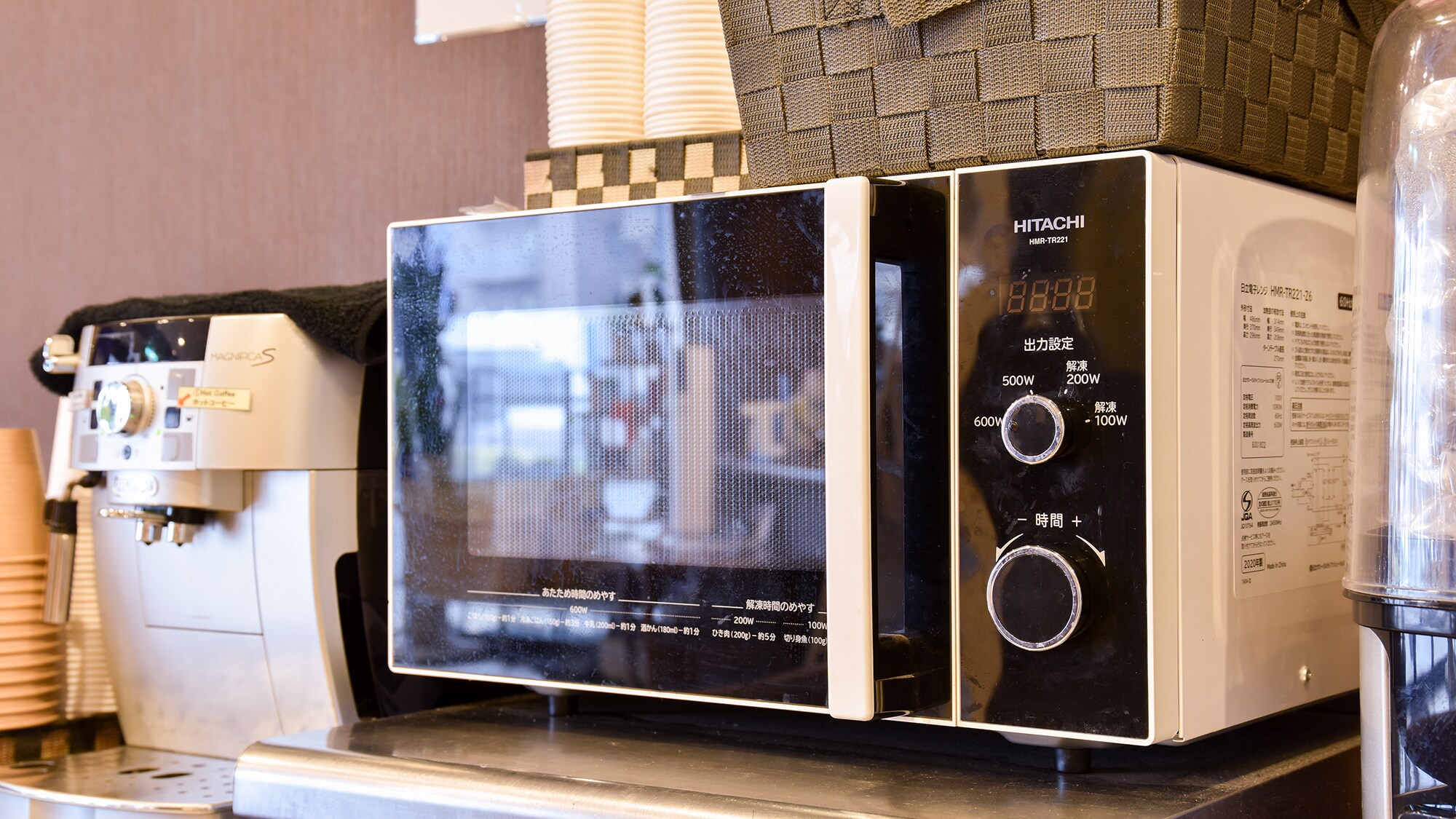 ** [Inside the building] There is a microwave next to the front desk. Please feel free to use it for anything you buy at the convenience store.
