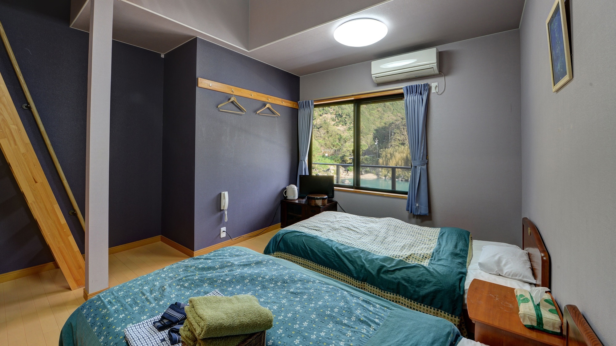 * [Western-style room with loft] A twin bedroom with a loft.