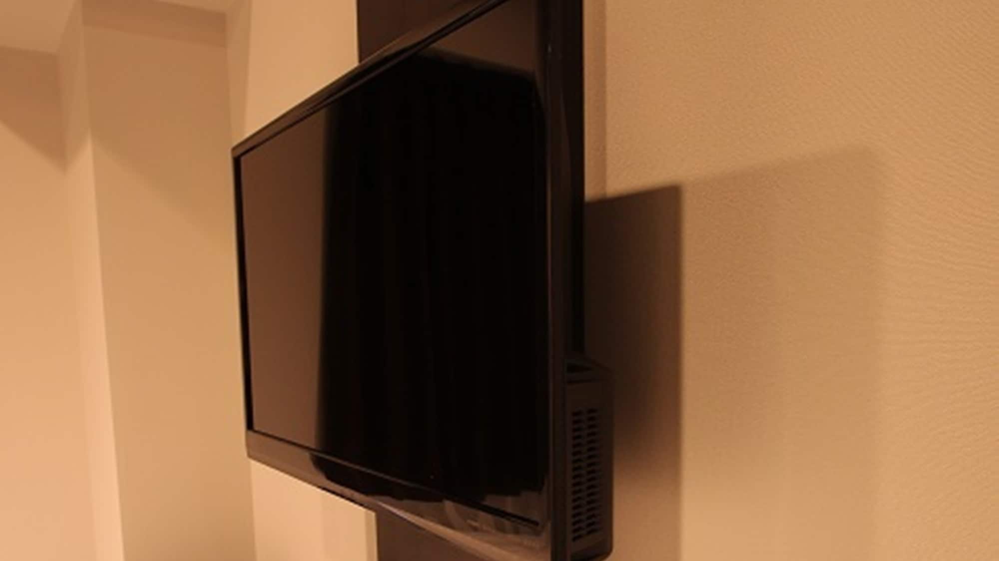 TV | A wall-mounted TV that you can enjoy while relaxing in bed.