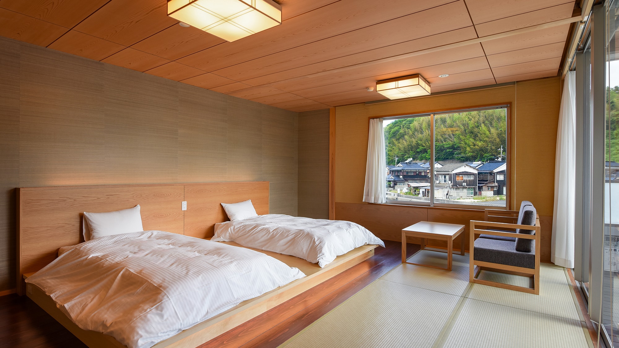 *Canal Japanese-Western Room (205): A Japanese-Western room facing the canal. Includes a terrace and a semi-open-air bath.