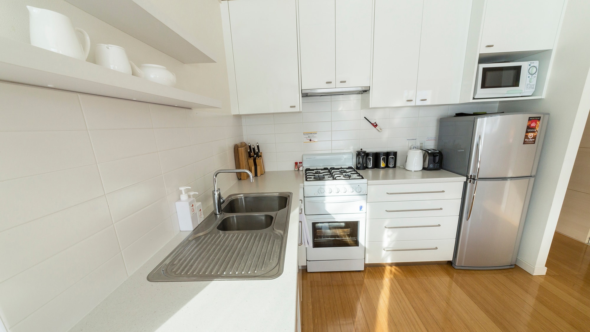 Kitchen equipped with cookware and cutlery