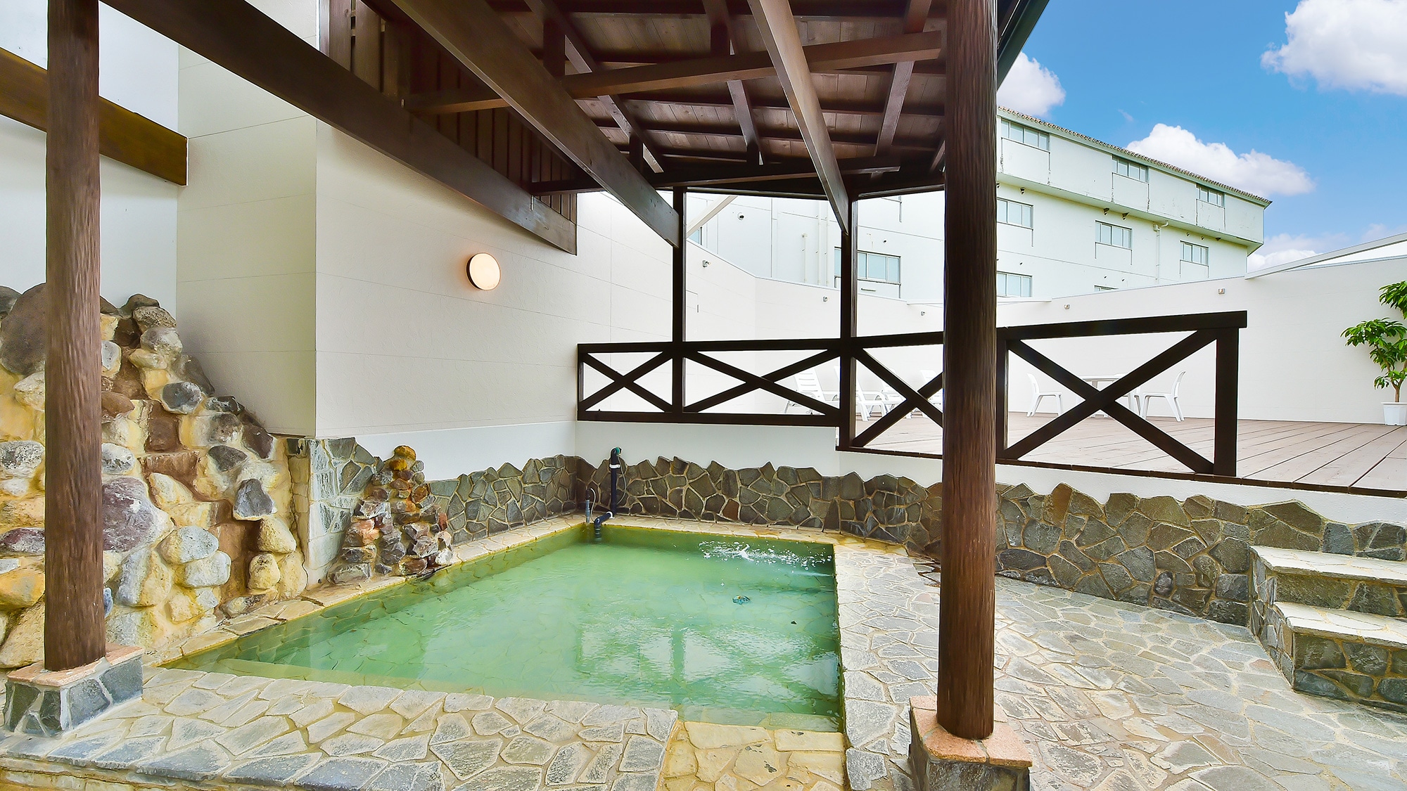 A wooden deck is attached to the open-air bath of Shiosai