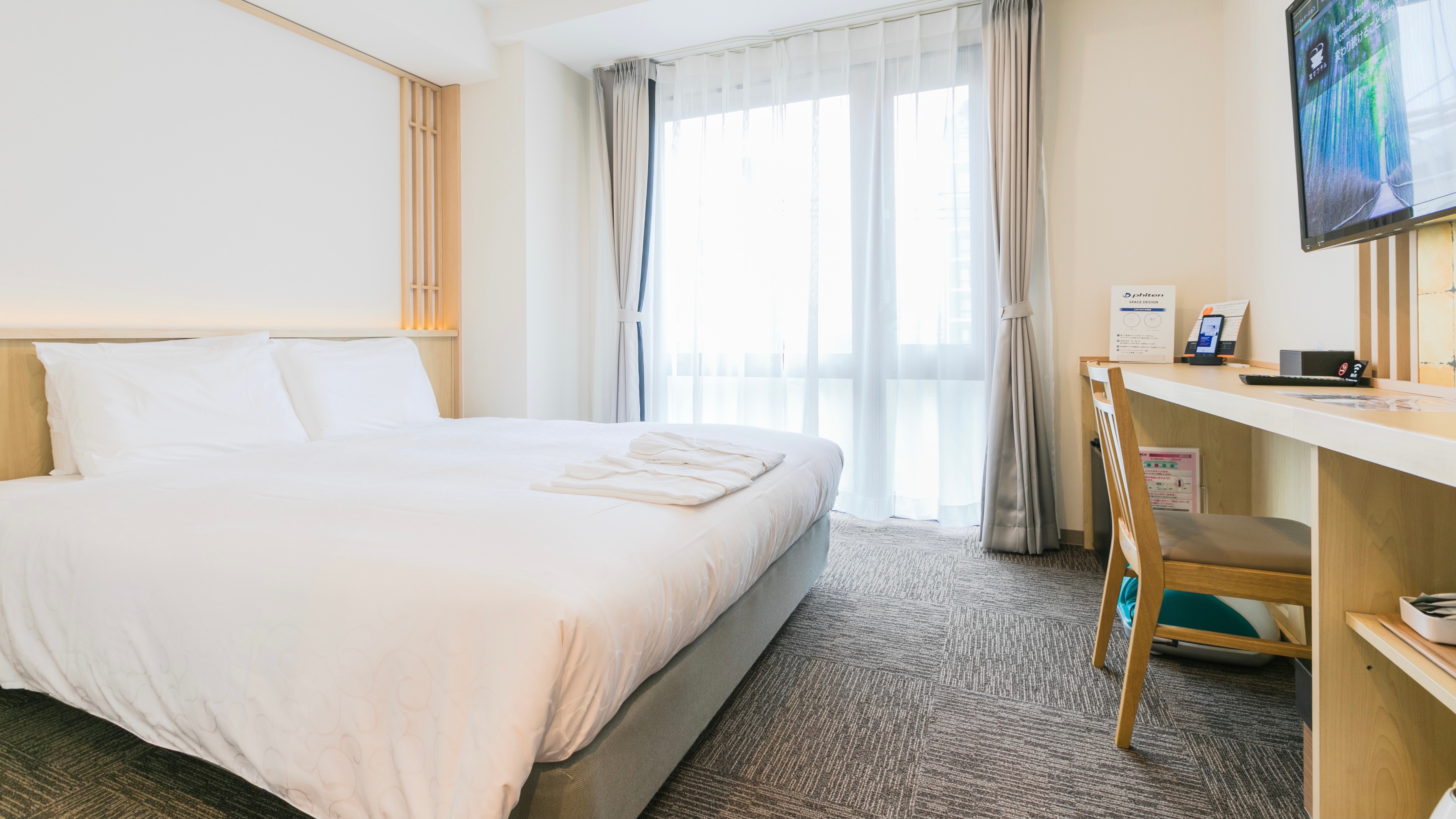 Phi Ten Double Room with aqua titanium-impregnated guest room, gold duvet, and foot massager