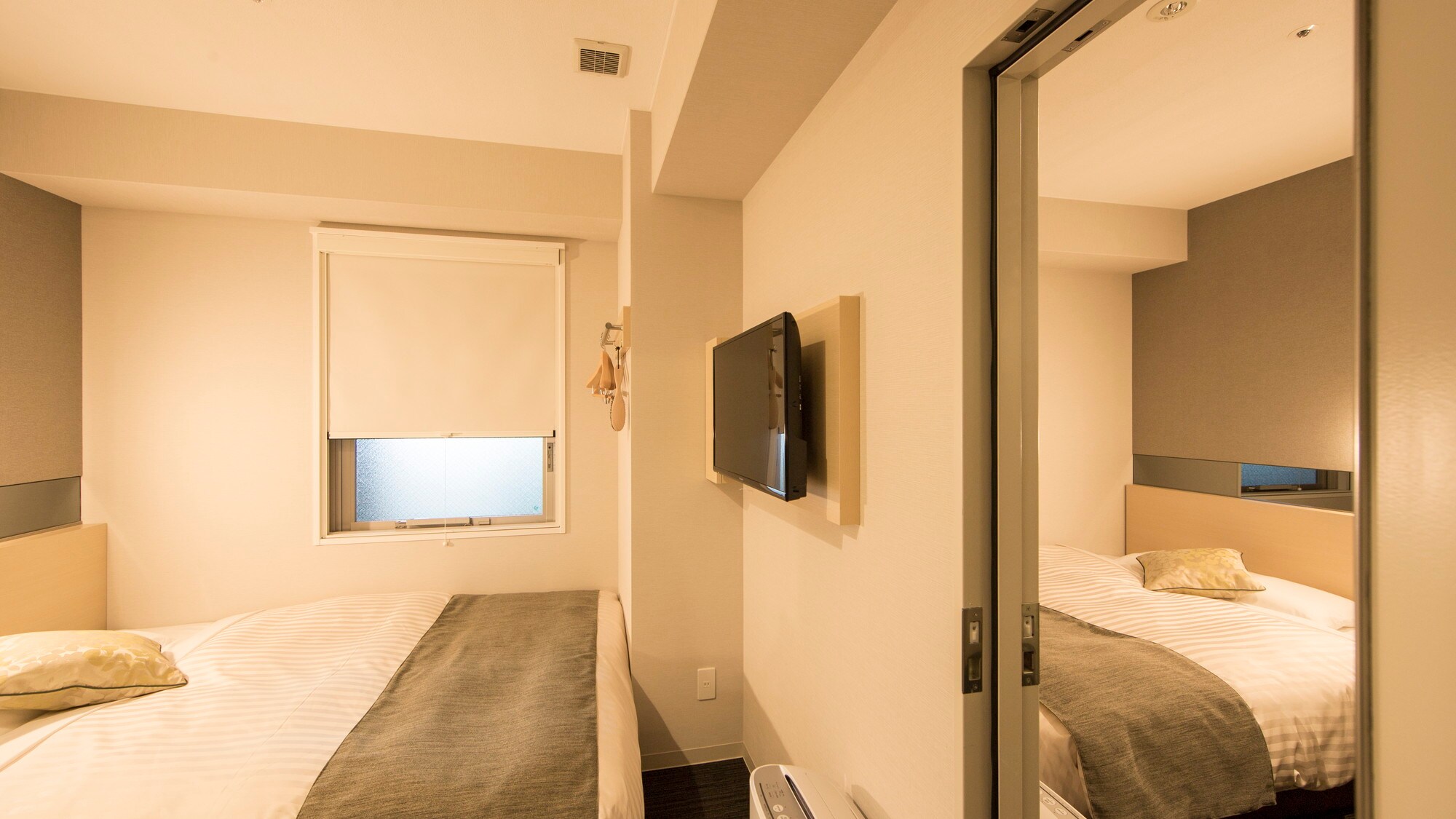 This room has two rooms with a door between them.