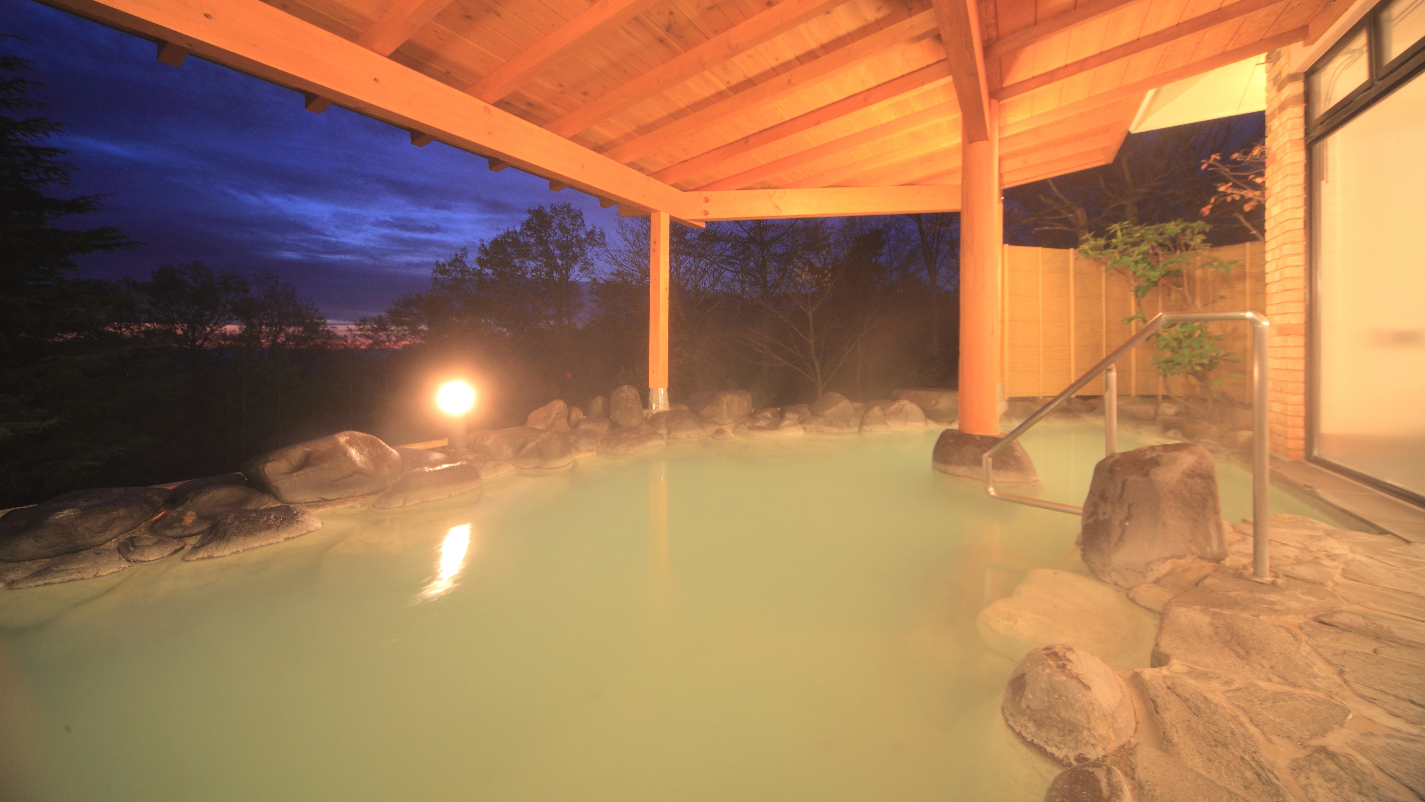 Open-air hot spring bath at night
