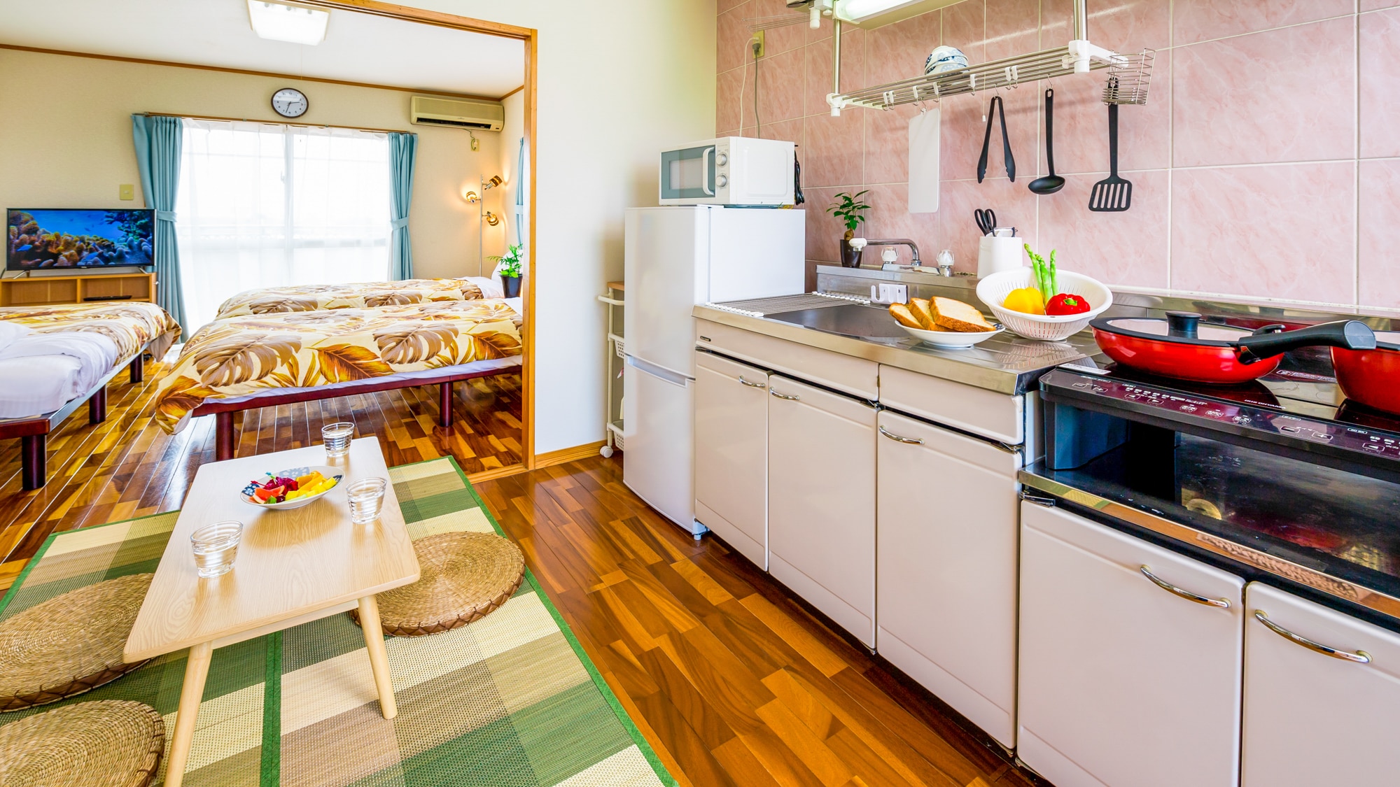 Kitchen and dining with abundant cooking utensils.