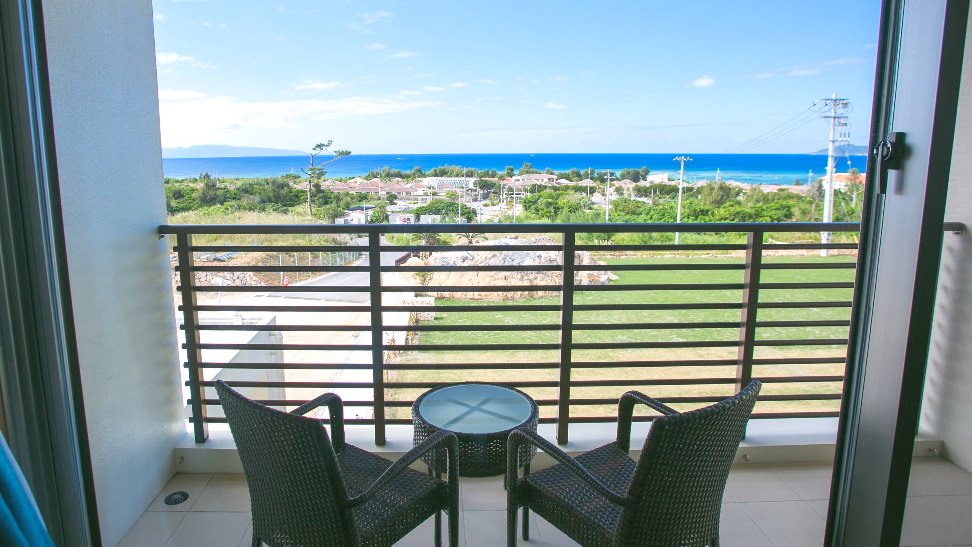 Each room has a second-floor terrace offering views of lush greenery and the sparkling sea.