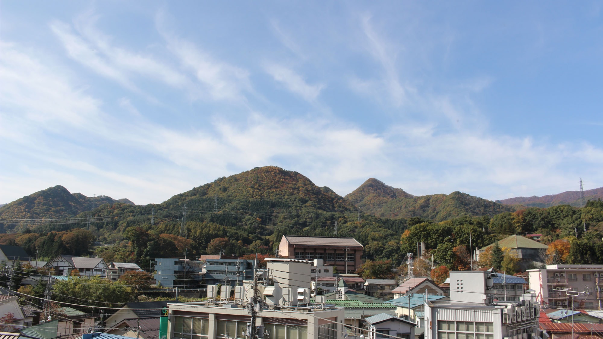 View from the guest room overlooking the hot spring town and mountains
