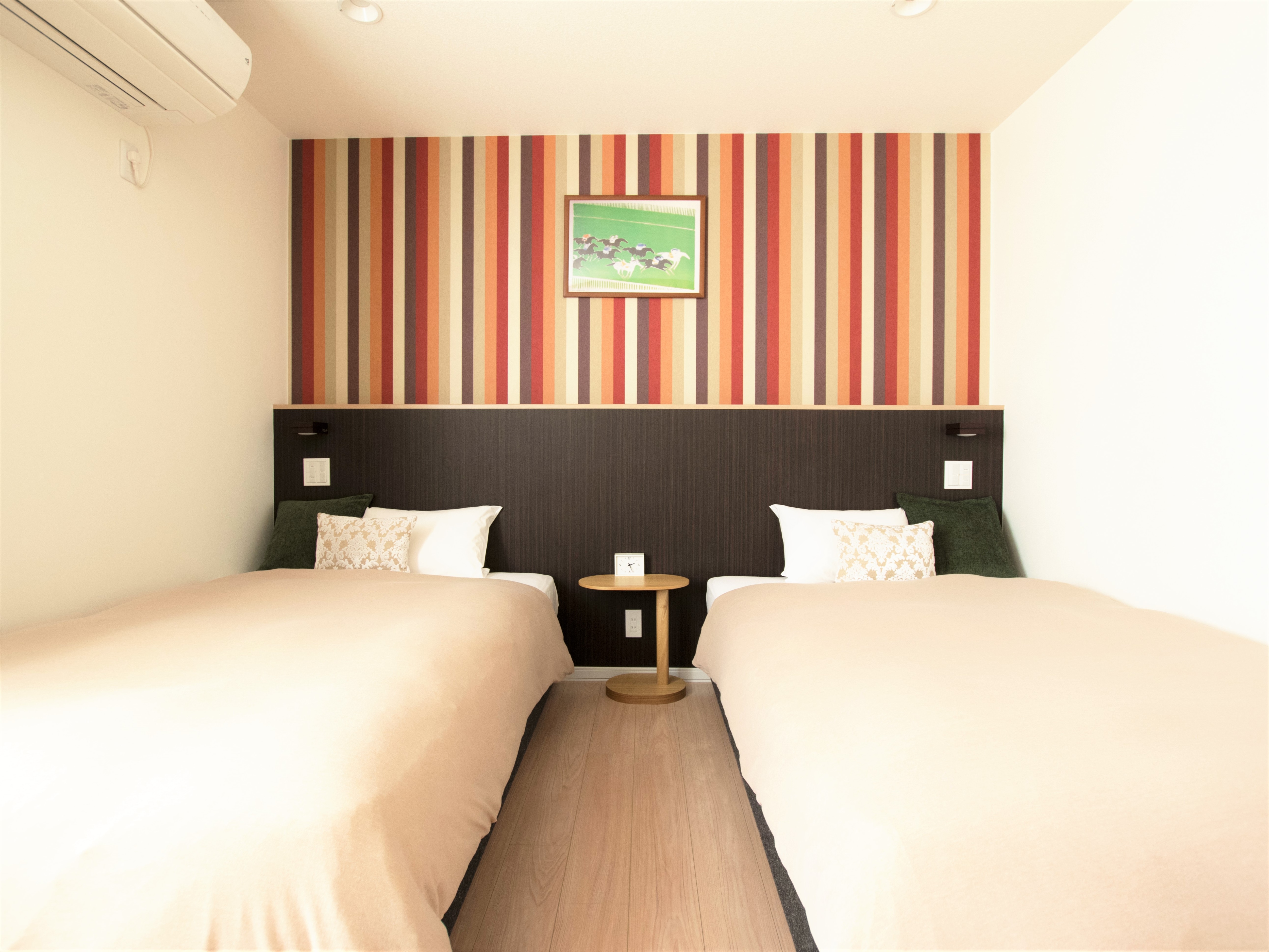 Twin room guest room image. Two beds can be joined together.