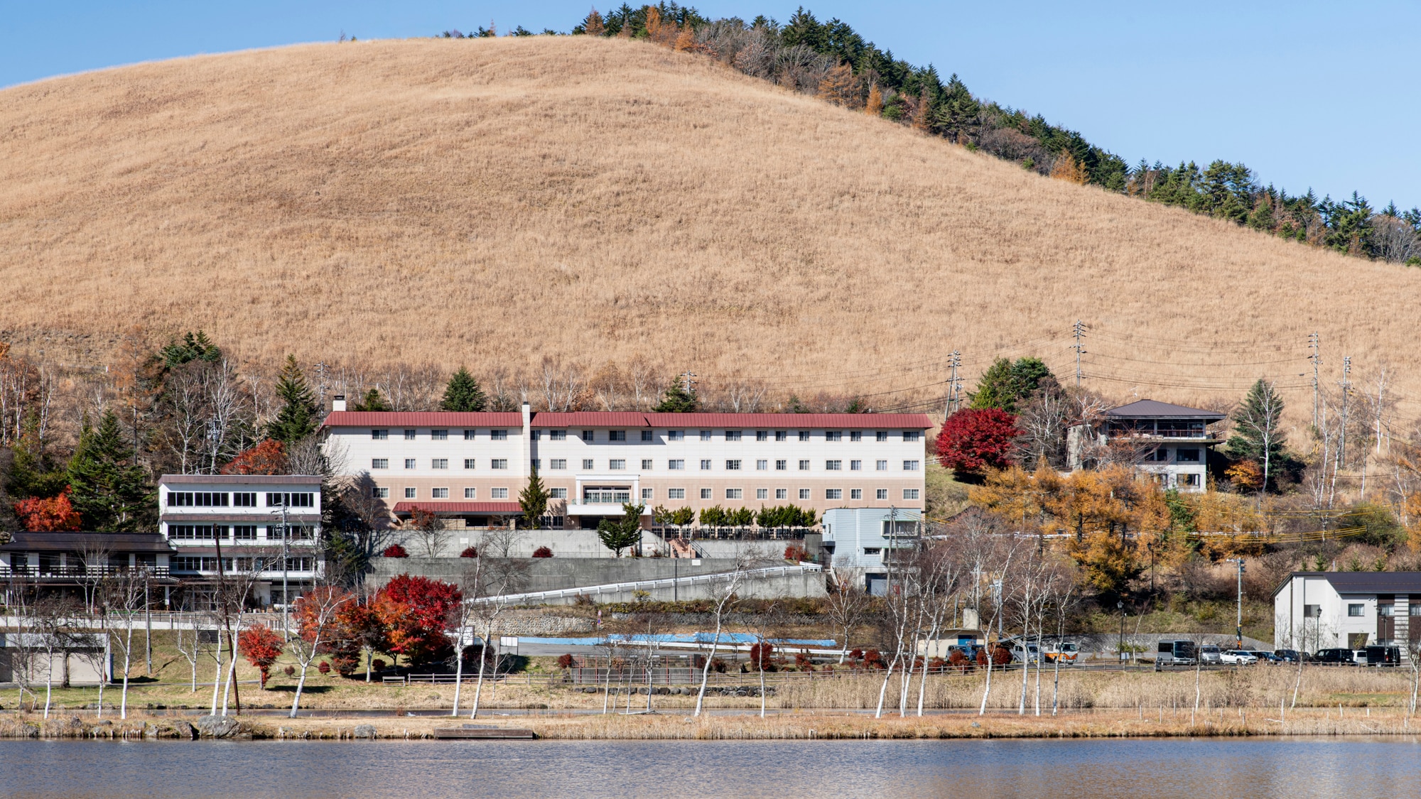 *Exterior (Autumn) / A location overlooking Lake Shirakaba with the Kurumayama Plateau in the background