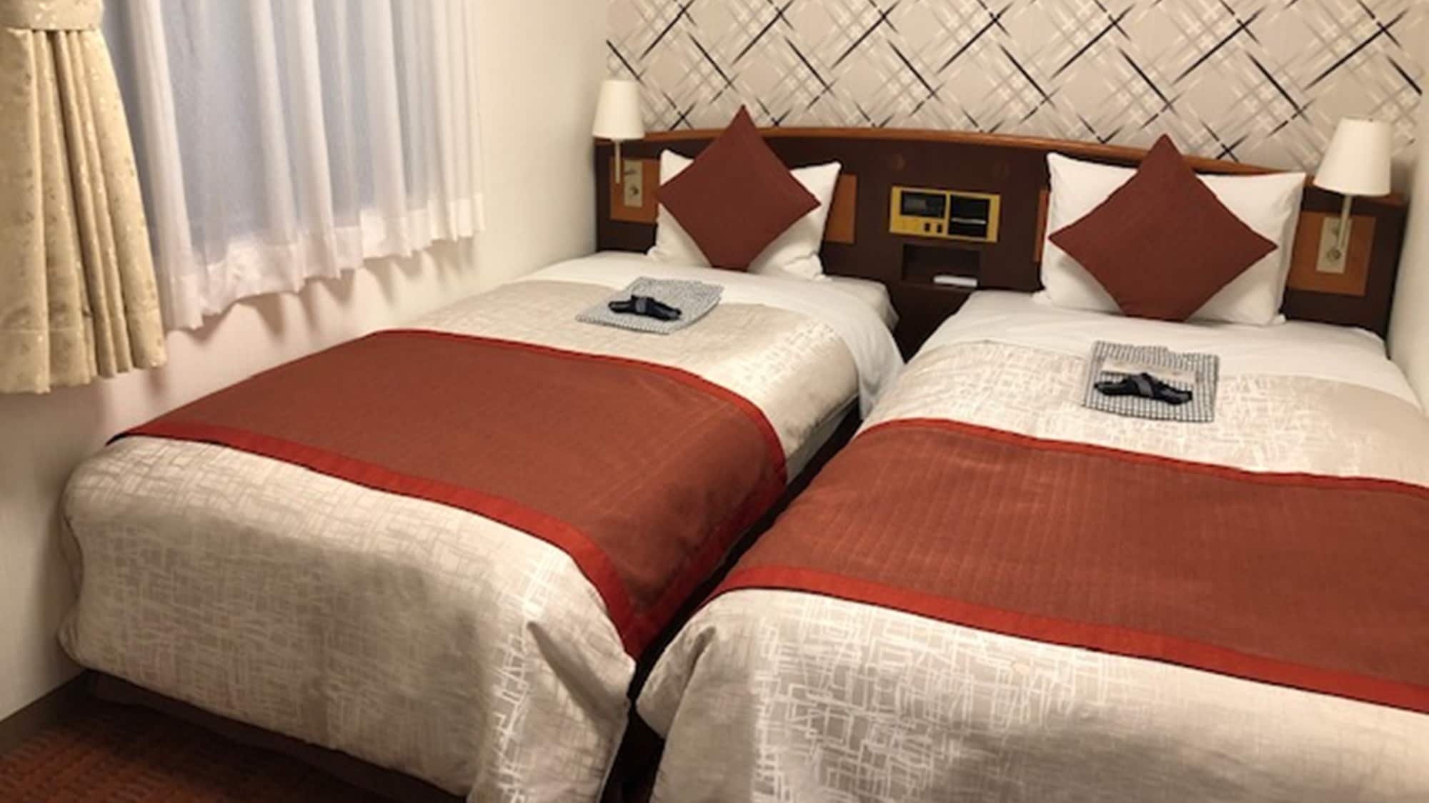 Compact twin (Yukata is available in the guest rooms)