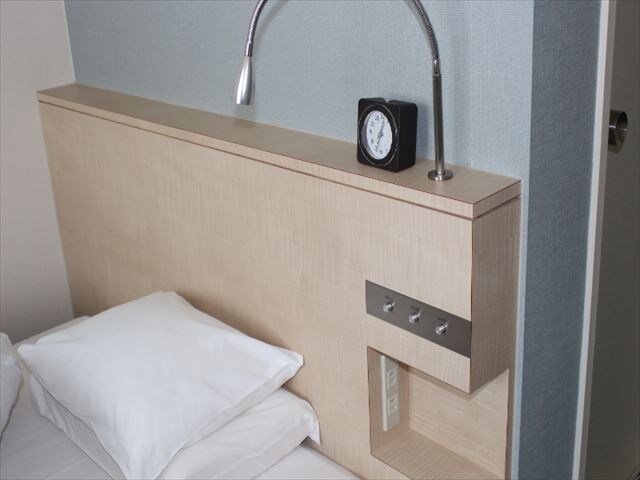 There is a mobile charging space for the headboard of the Western-style room.