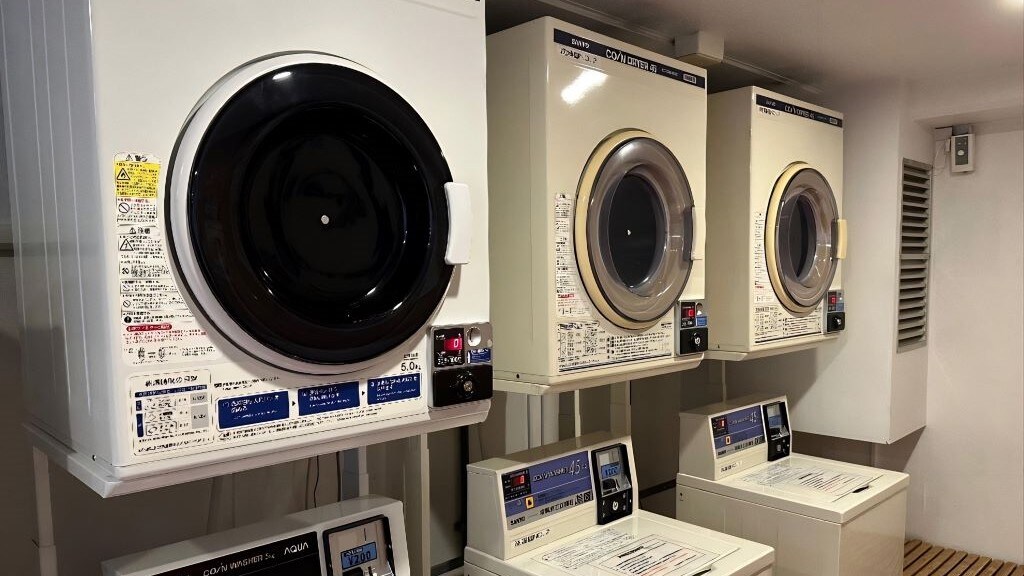 There is a coin laundry on the second floor. (3 washing machines, 3 dryers)