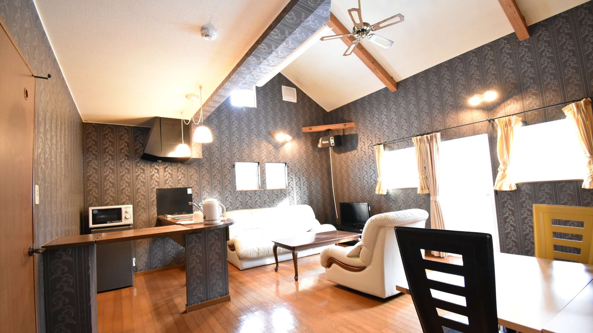 ・Family A: The living room is equipped with a sofa and a dining table.