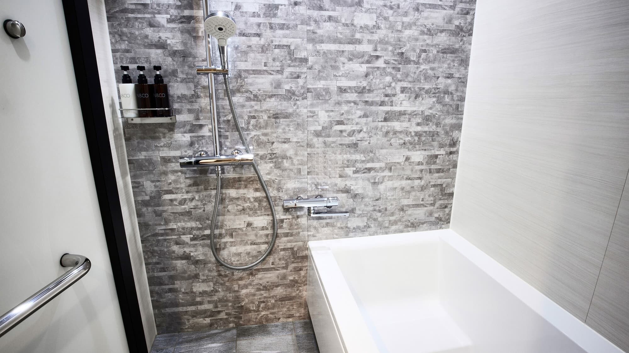 Orto Japanese | Bathroom with a separate washing area and an overhead shower to soothe your mind and body.