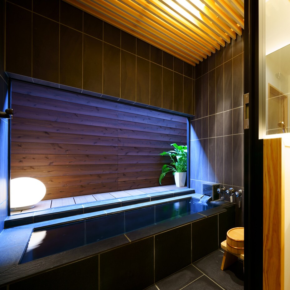 Kingfisher stone semi-open-air bath with mini deck