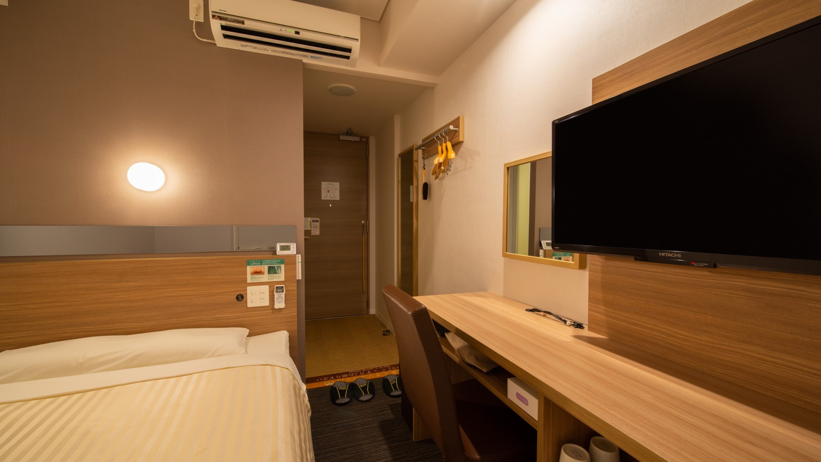 At night, the room is enveloped in soft light.