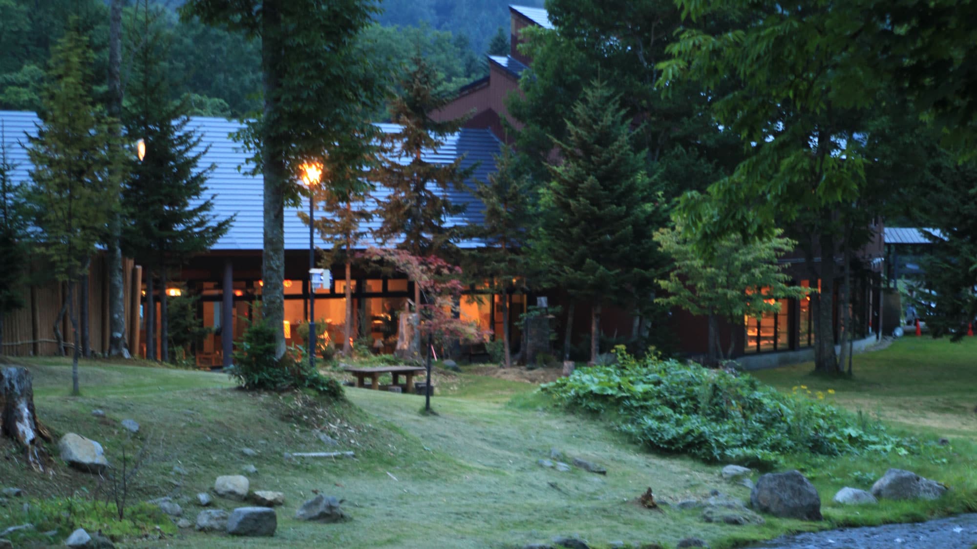 [Exterior] A single inn nestled deep in the forest, far away from the hustle and bustle of the city.