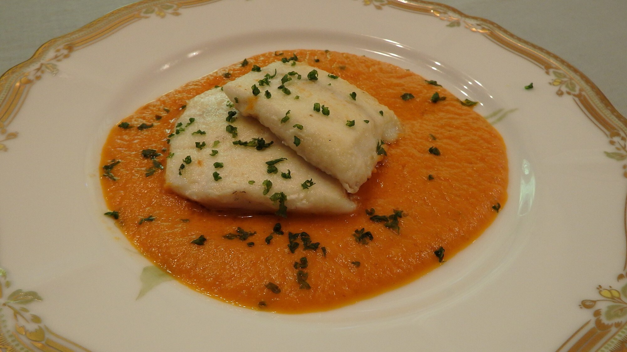 Fish dish example: Seasonal white fish with tomato sauce