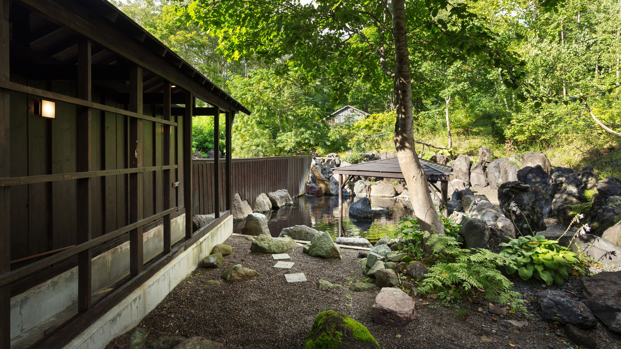 Summer open-air bath surrounded by fresh green