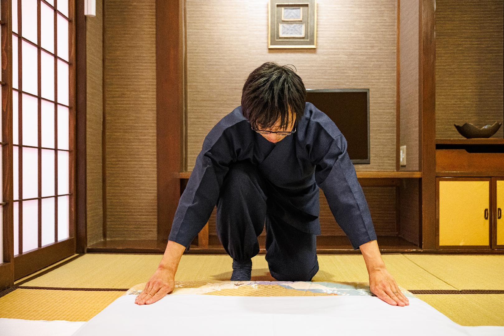 Stay at a ryokan on a futon.