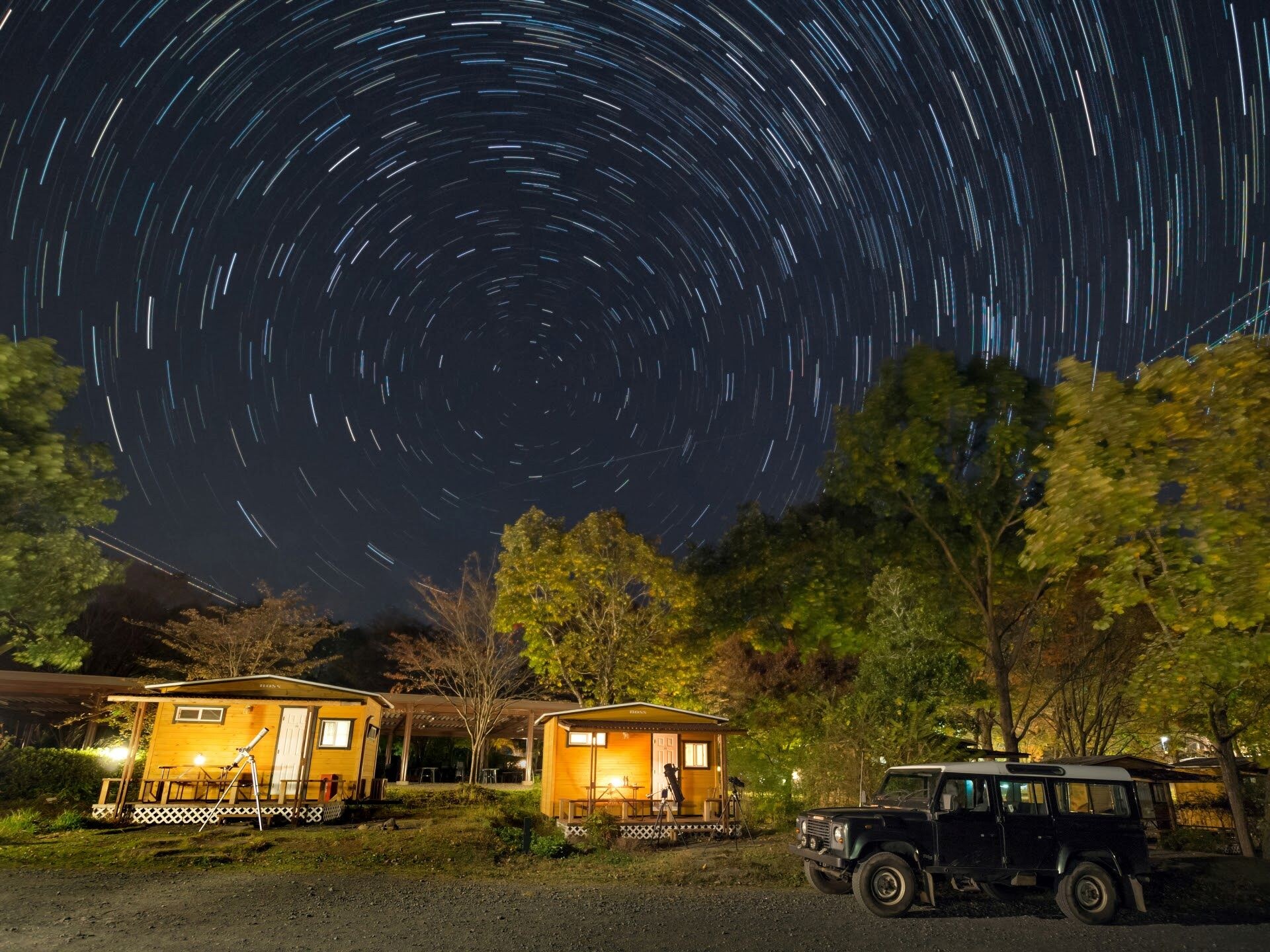 Forest and Starry Sky Camp Village Log Cabin exterior