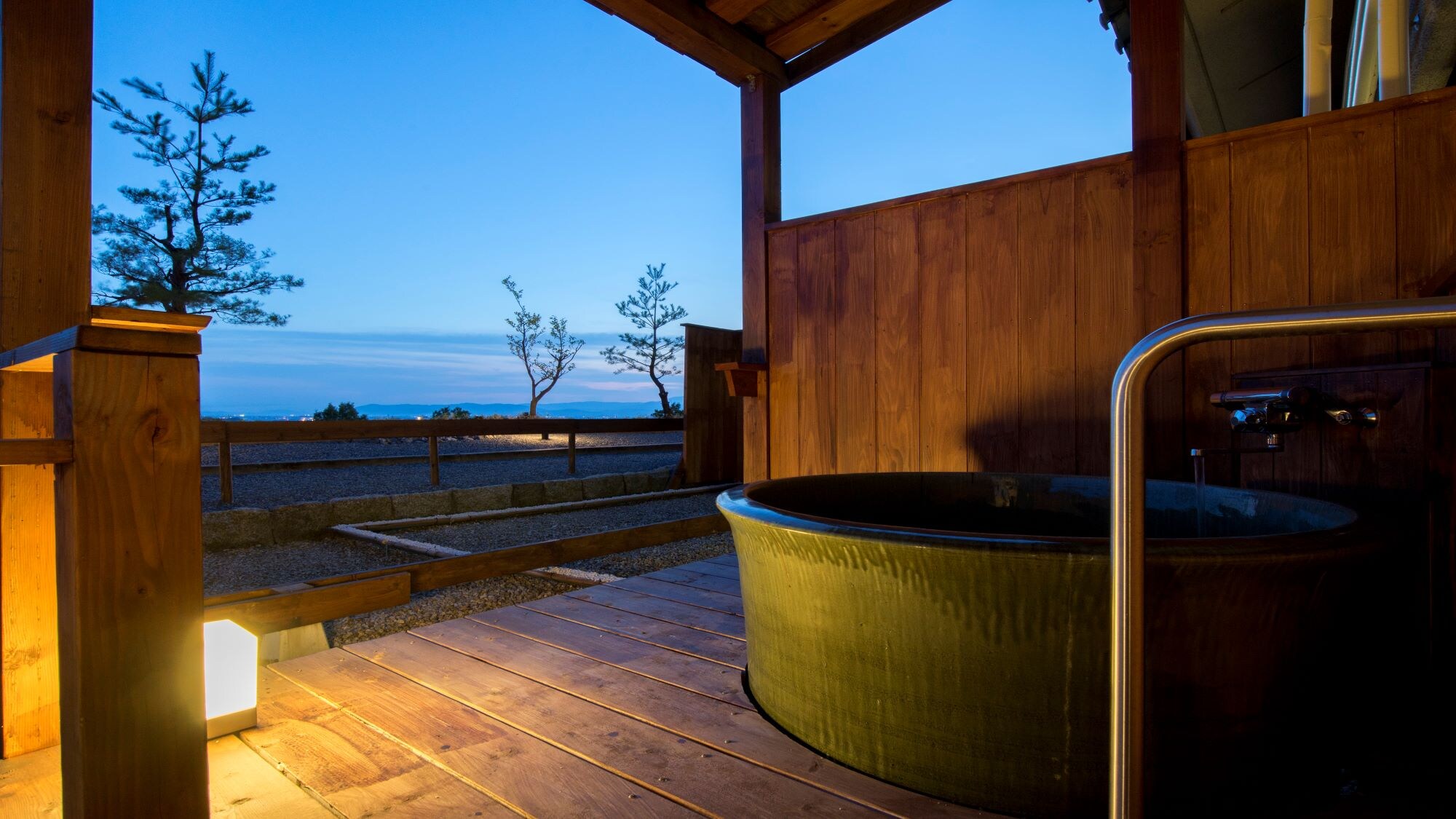Japanese-Western style room with a superior open-air bath *An example of a guest room open-air bath