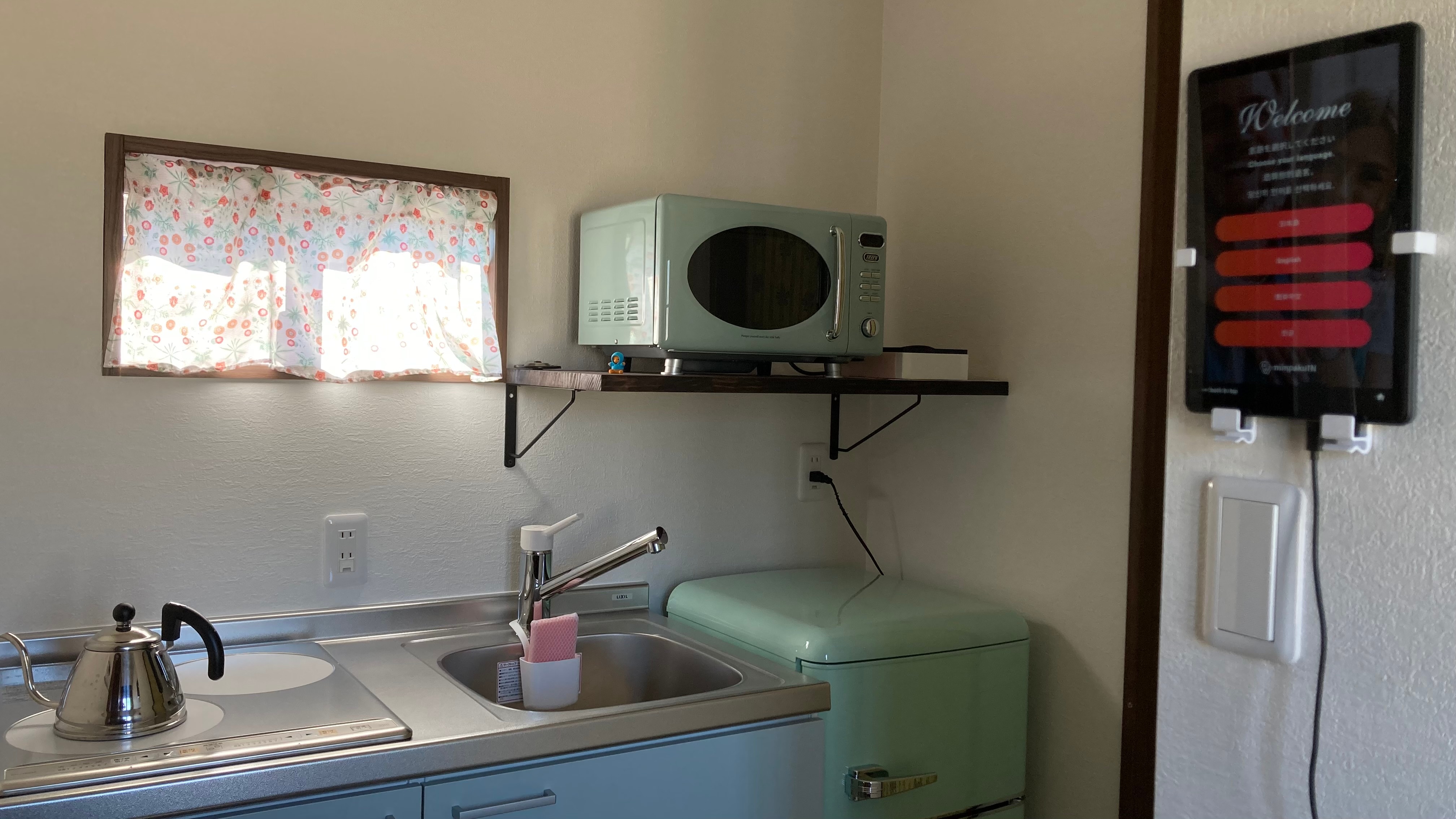 Kitchen and check-in terminal: Our accommodation uses a self-check-in system.