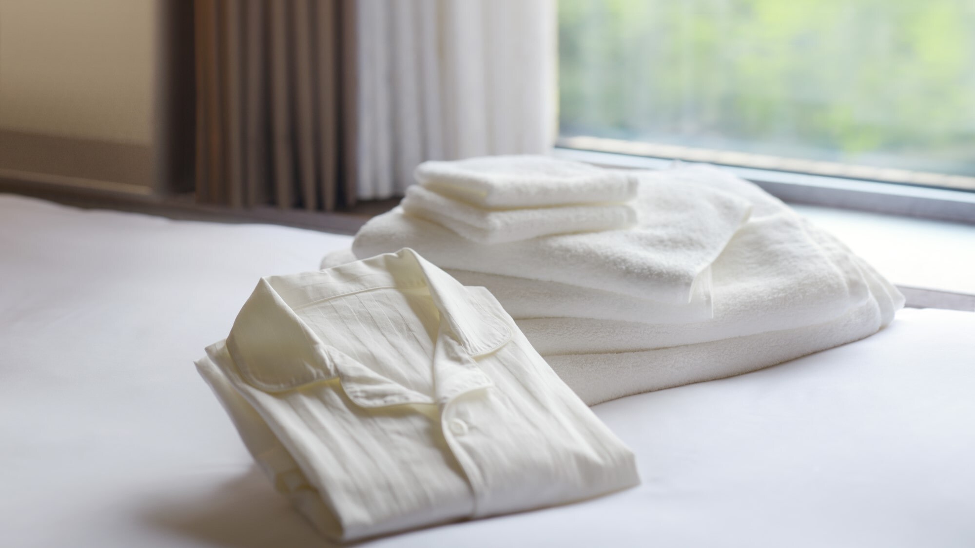 Organic cotton linen, towels, and pajamas. High-quality, soft textures for a comfortable stay.