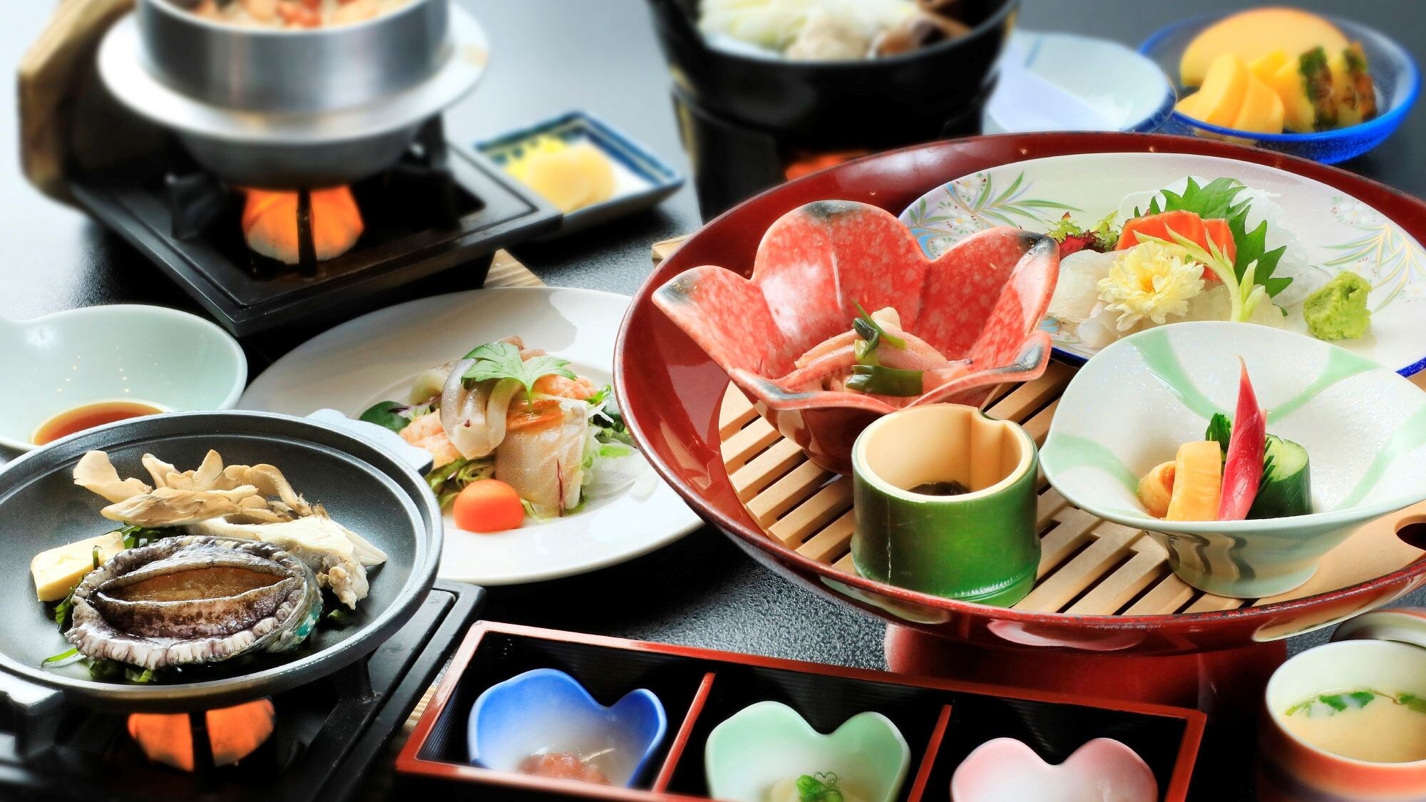 Large bowl of abalone set meal with ceramic grill