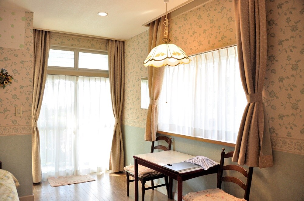 The living/dining room is equipped with a table and chairs, providing a comfortable space to dine.