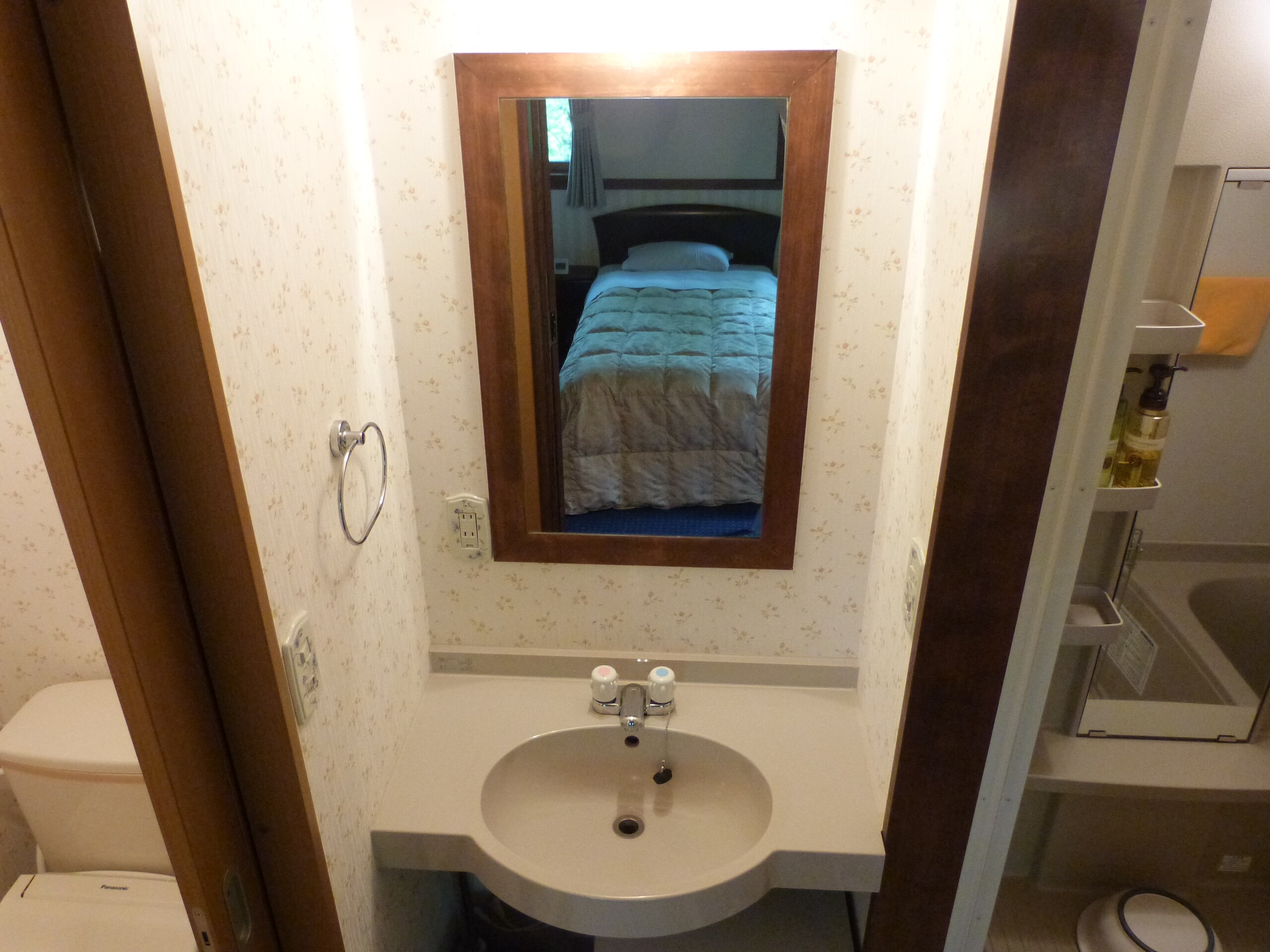 Deluxe Twin Room A's washbasin, bath and toilet