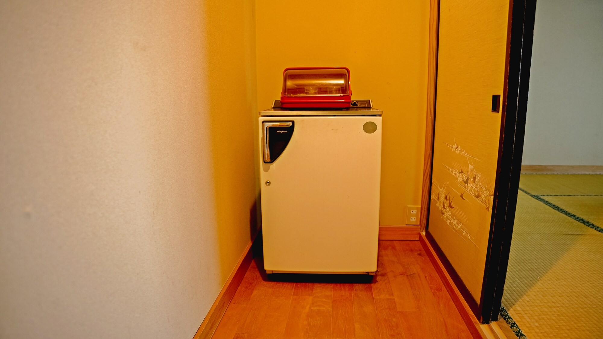 Refrigerator: This is the refrigerator located in the Japanese-style room. It is a Showa-era retro refrigerator.